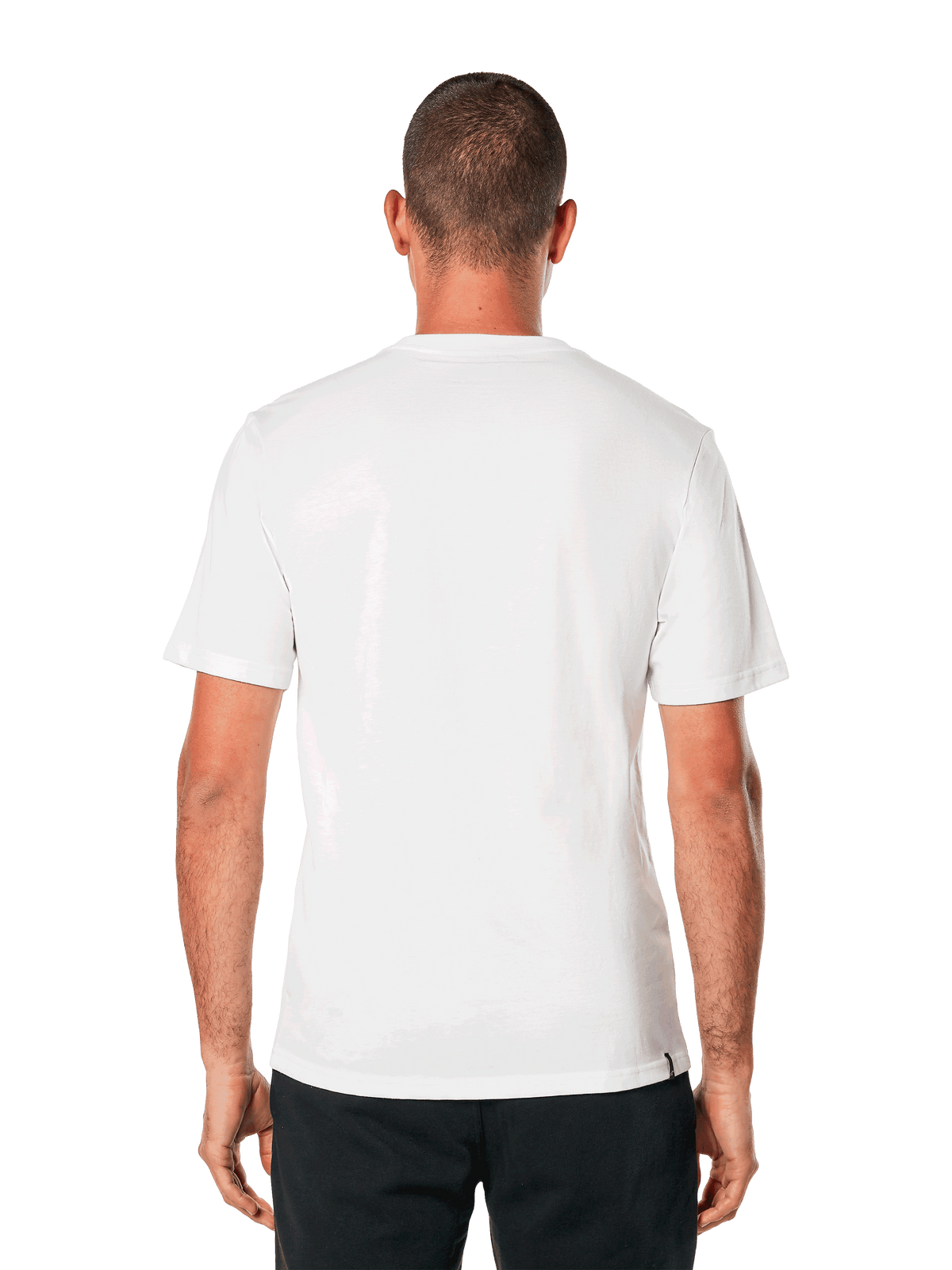 Alpinestars MX Helmet CSF Tee, camiseta de manga corta, blanca, vista posterior, combinada con pantalones negros, diseño casual inspirado en el motociclismo