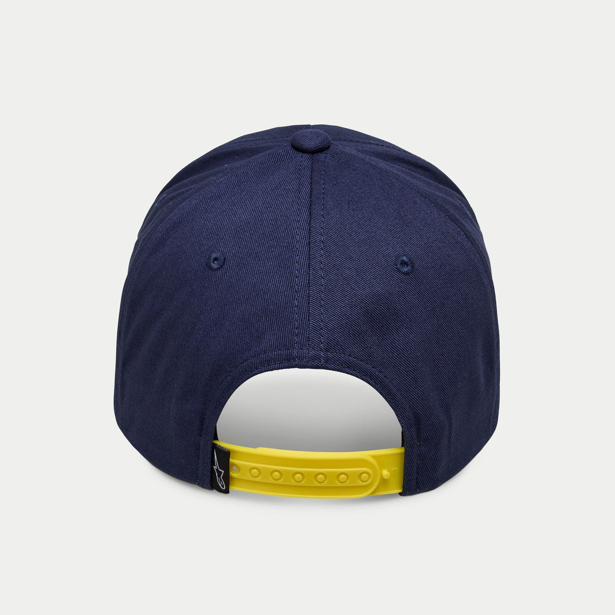 Alpinestars Par Hat, Navy snapback cap, rear view featuring a bright yellow adjustable strap and small black logo tag, structured crown in navy cotton twill, casual sportswear headwear