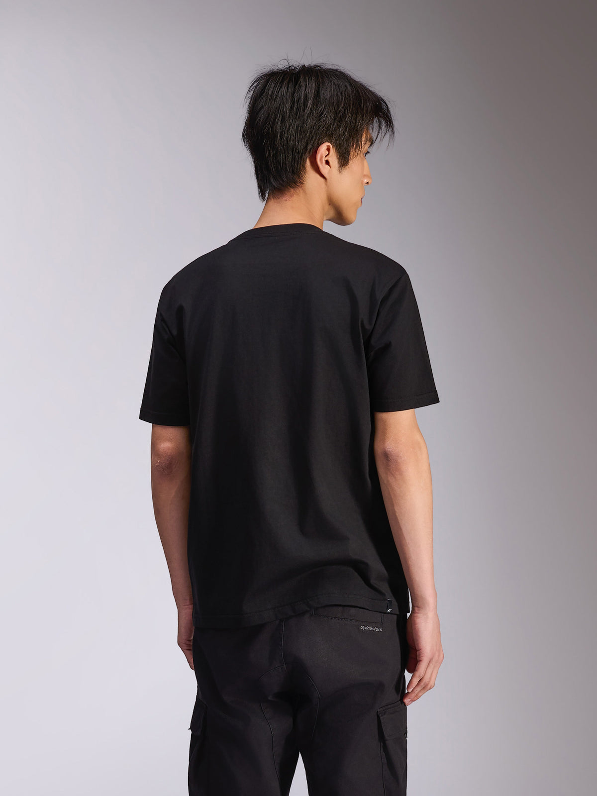 Alpinestars Noka CSF Tee, camiseta de manga corta, negra, vista posterior, ropa urbana casual inspirada en el automovilismo