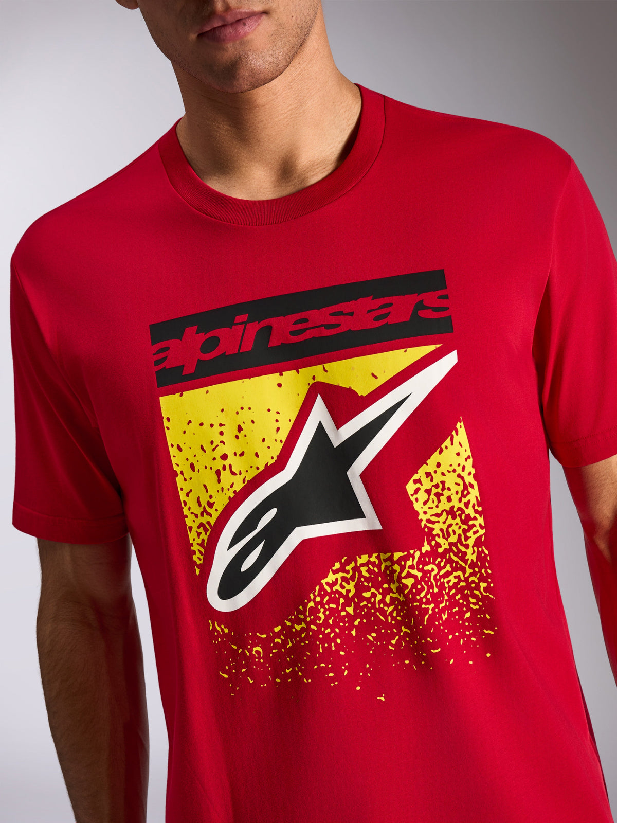 Alpinestars Noka CSF Tee, Short Sleeve T-Shirt, Red, Front graphic with black Alpinestars text and Astars logo over yellow speckled design, Casual Motorsport Streetwear