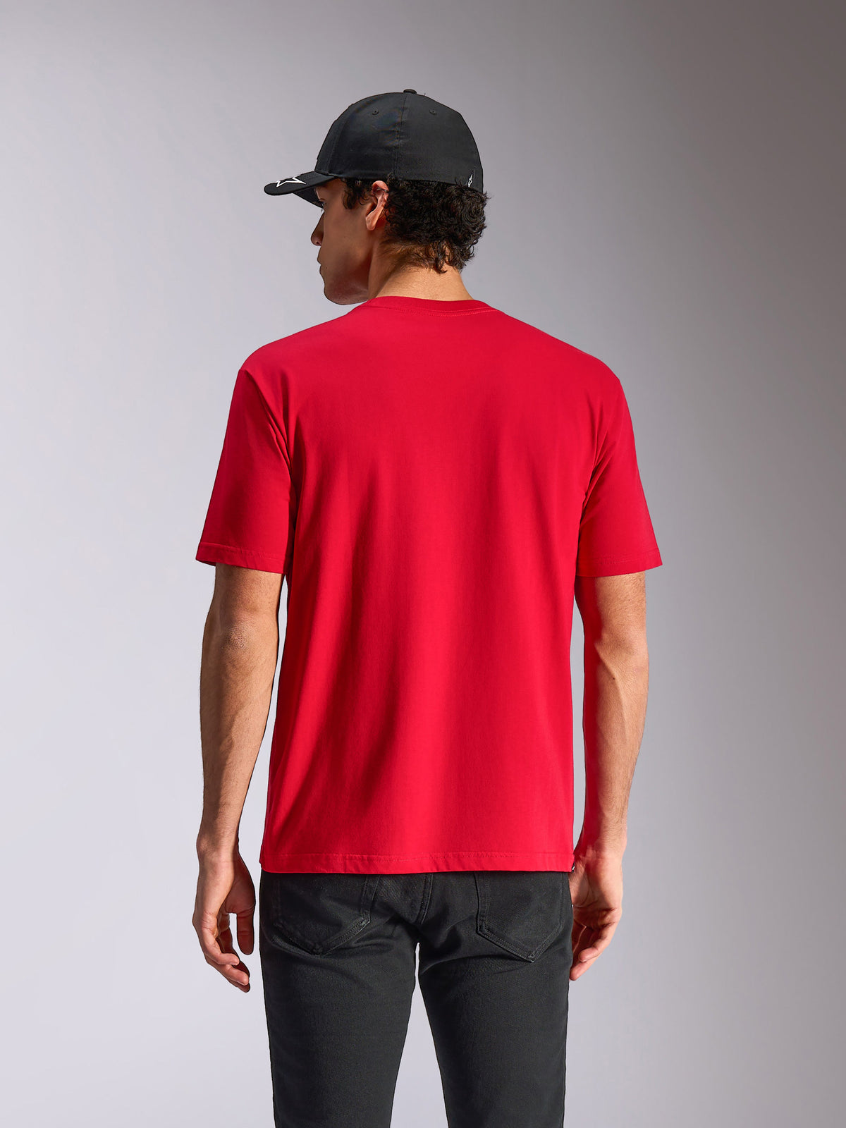 Alpinestars Noka CSF Tee, Short Sleeve T-Shirt, Red, back view on model, casual motorsport streetwear, styled with black cap and dark pants