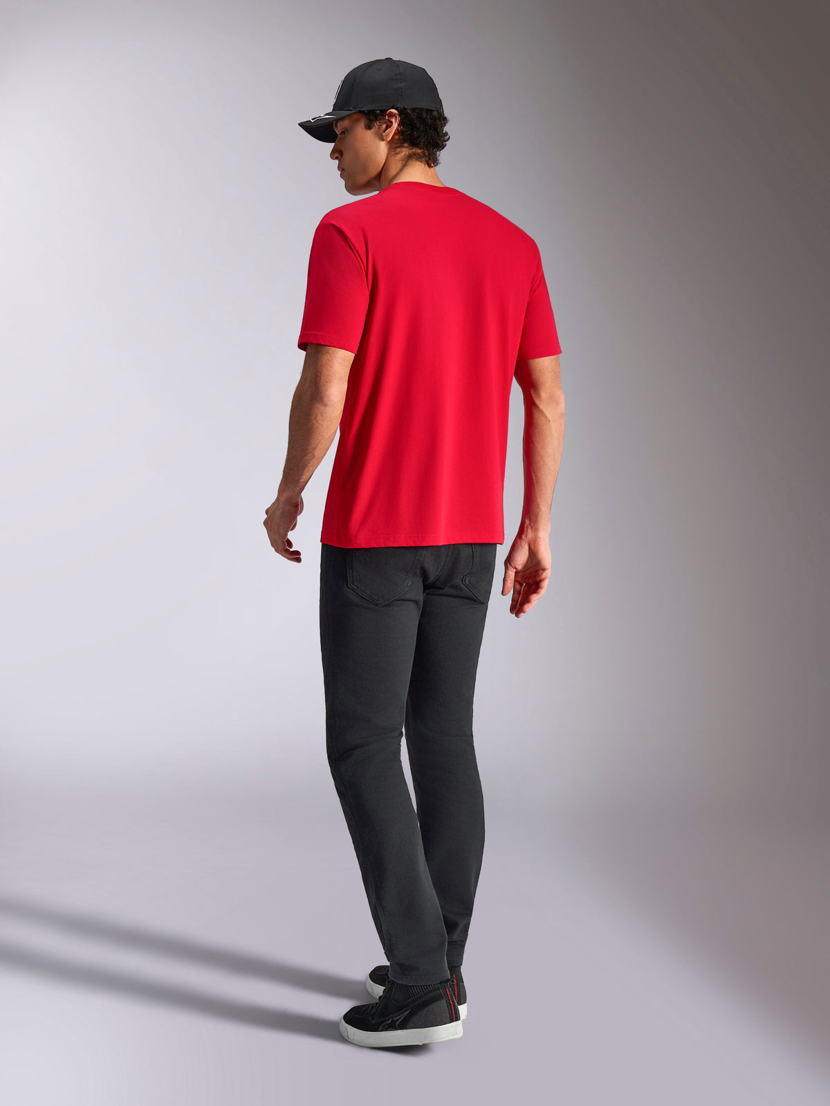Alpinestars Noka CSF Tee, Short Sleeve T-Shirt, Red, back view, styled with black pants and a black baseball cap, casual motorsport-inspired streetwear