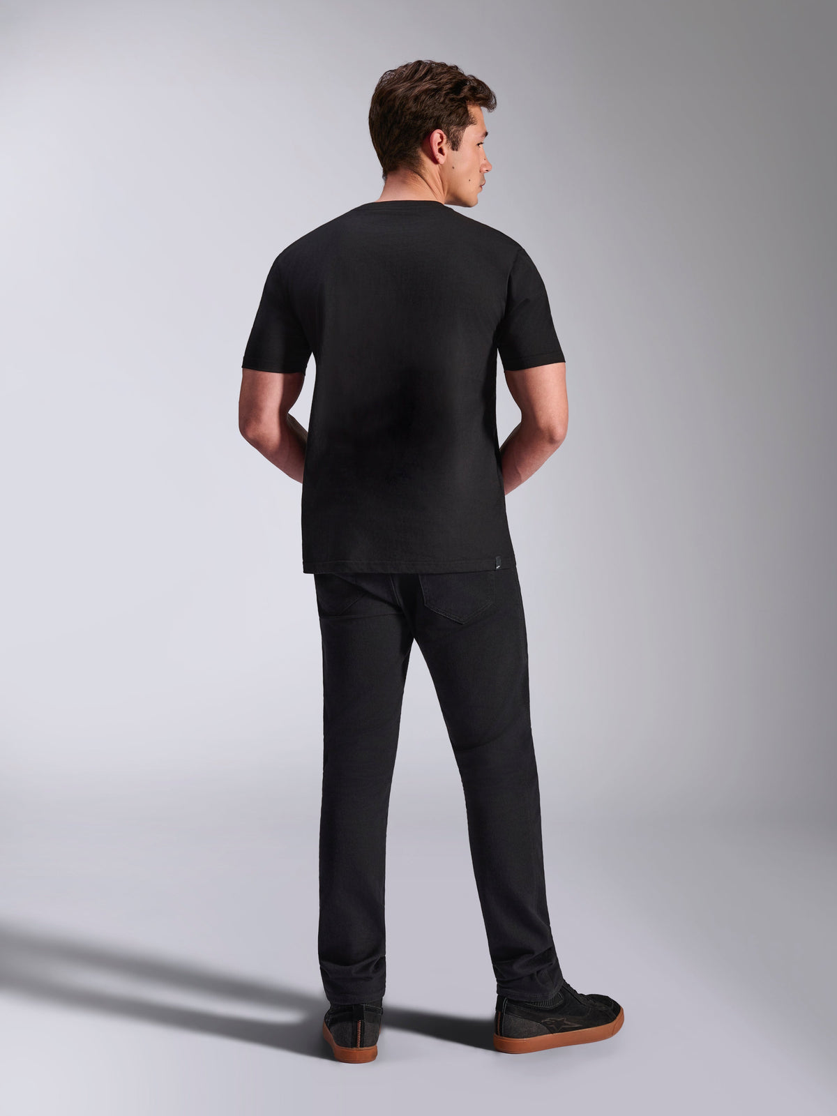 Alpinestars Abus CSF Tee, Short Sleeve T-Shirt, Black, Back view on model paired with black pants, Casual Motorsport Sportswear