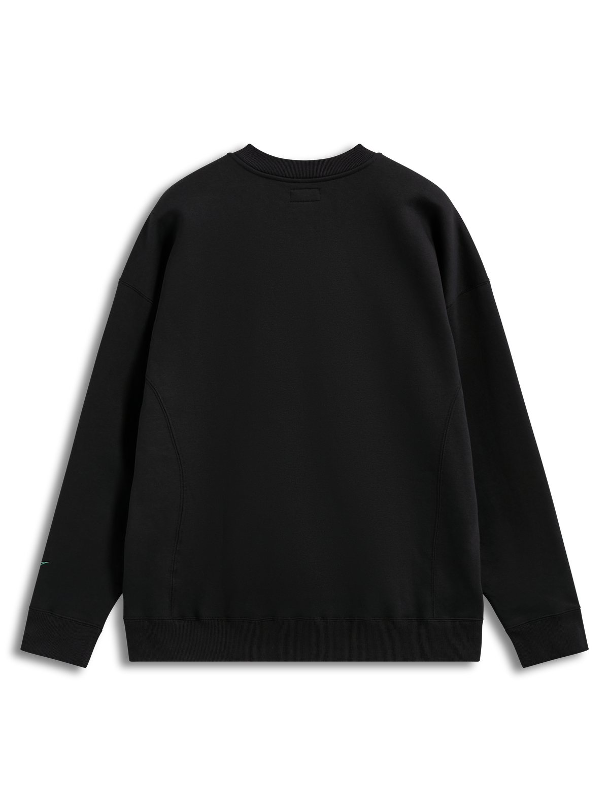 Alpinestars Guise Oversized Crew, sudadera negra de forro polar, ajuste holgado, vista trasera y costuras en el cuerpo.