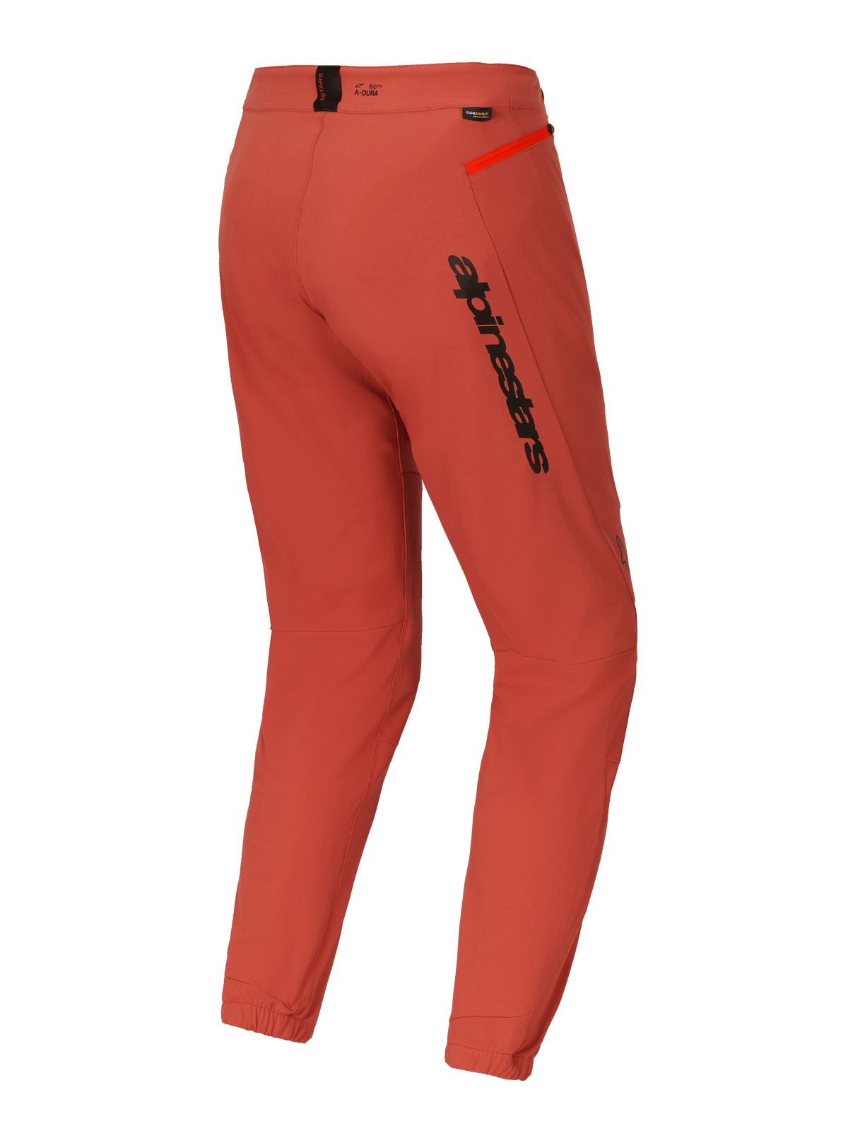 Pantalones Alpinestars A-Dura Elite, pantalones de ciclismo de montaña (MTB), naranja oscuro, vista trasera de tres cuartos con logotipo negro de Alpinestars en el muslo, detalle de cremallera en naranja brillante en la cadera y puños elásticos, equipamiento técnico de ciclismo de alto rendimiento