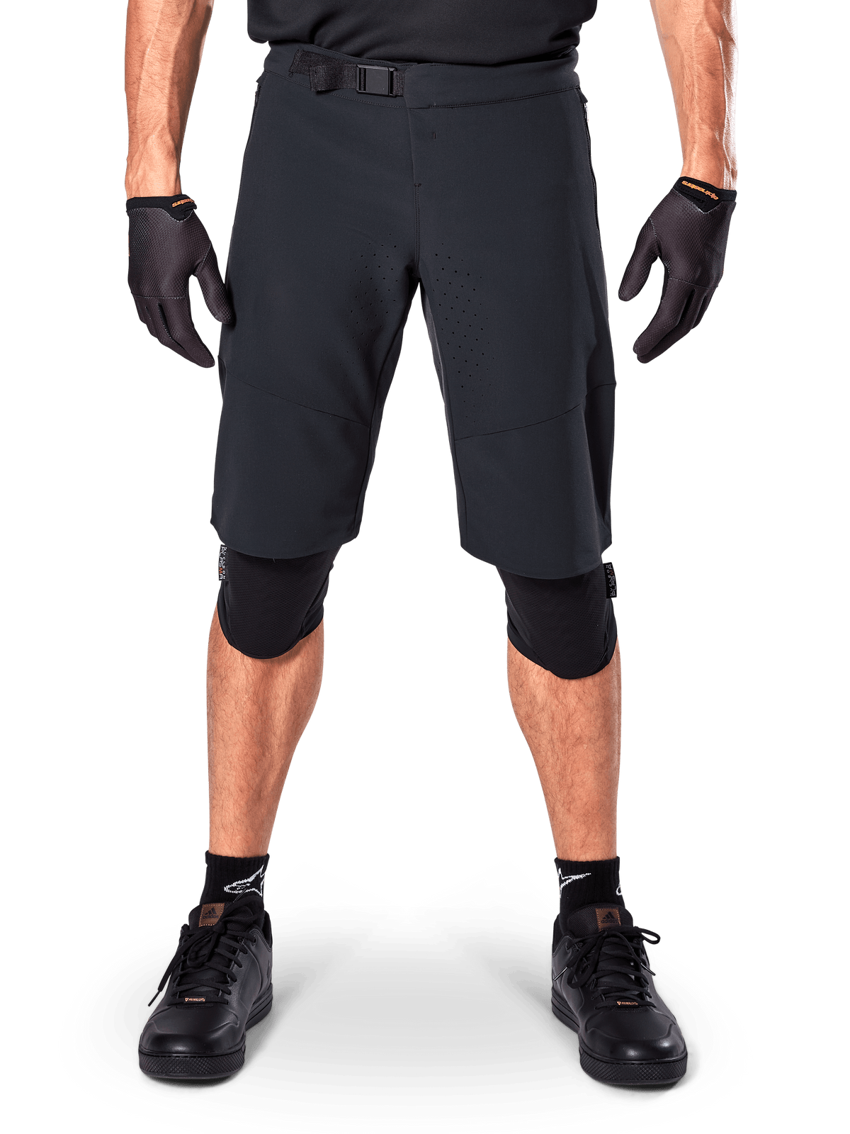 Alpinestars A-Aria Elite Shorts, Mountain Bike Shorts, Black, worn with knee pads and black gloves, featuring laser-cut ventilation and an adjustable buckle waist, performance off-road cycling gear