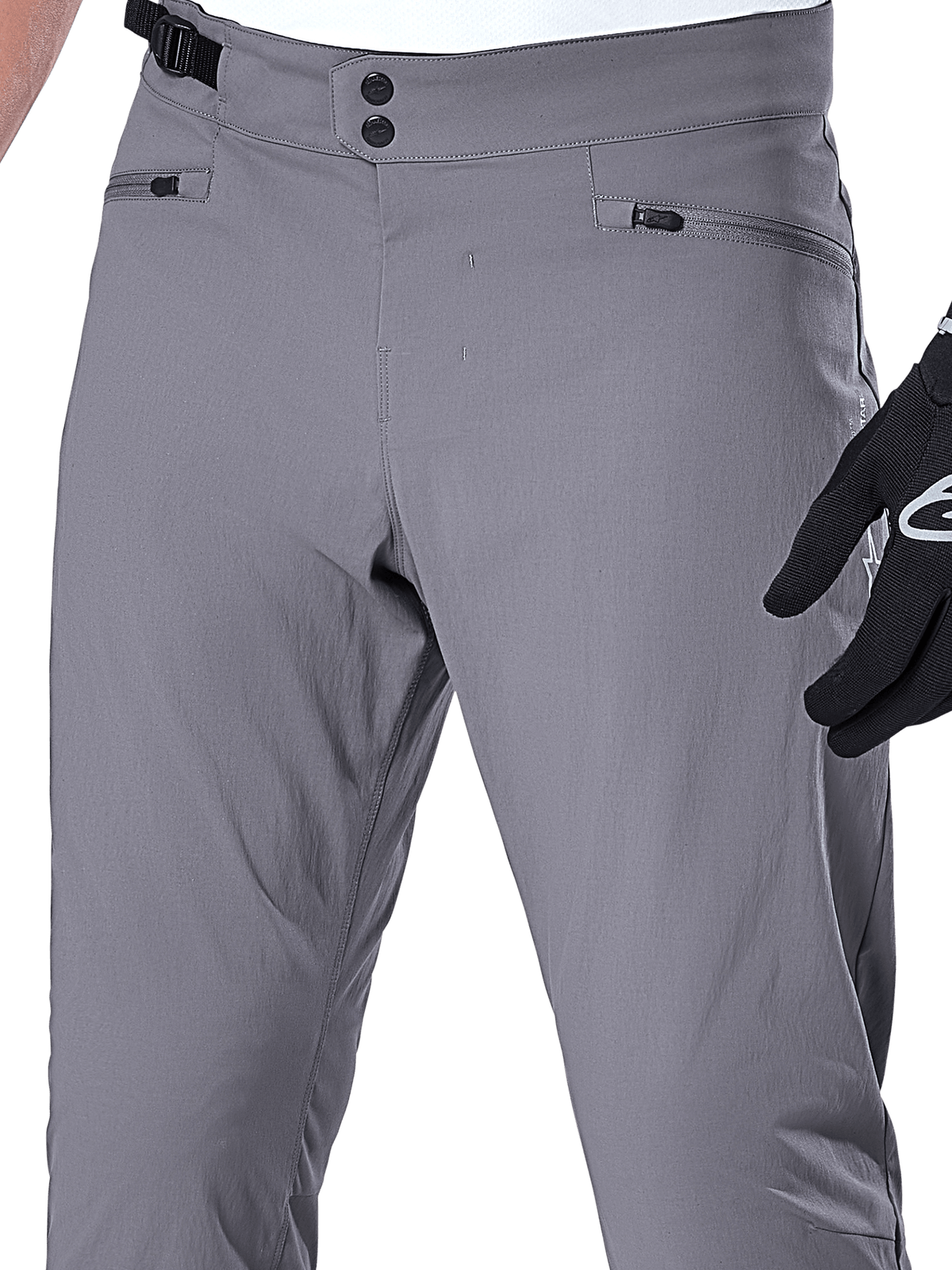 Pantalones Alpinestars A-Dura, pantalones de MTB, gris oscuro, primer plano del área de la cintura con cierre de doble broche, ajustador lateral y bolsillos con cremallera, tejido elástico duradero para ciclismo de montaña