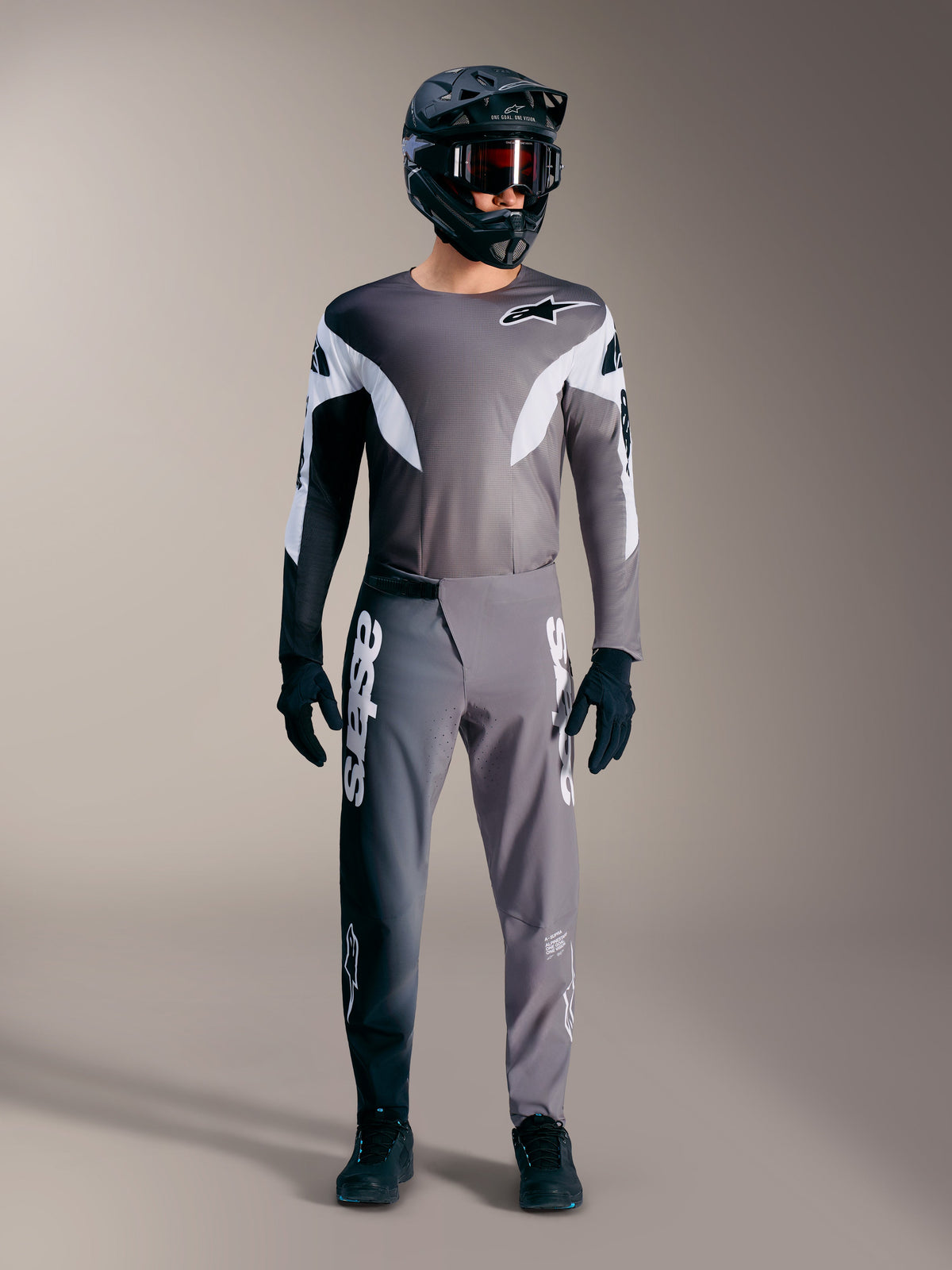 Maillot Alpinestars A-Supra Elite gris degradado, construcción ligera y gráficos blancos para entusiastas del MTB.