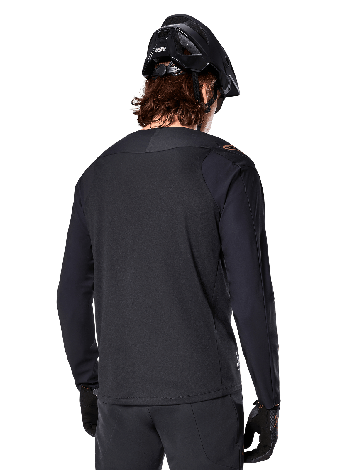 Alpinestars A-Aria Polartec Switch Jersey - Long Sleeve, Black, back view, worn with a black MTB helmet and gloves, featuring a drop tail design for off-road performance