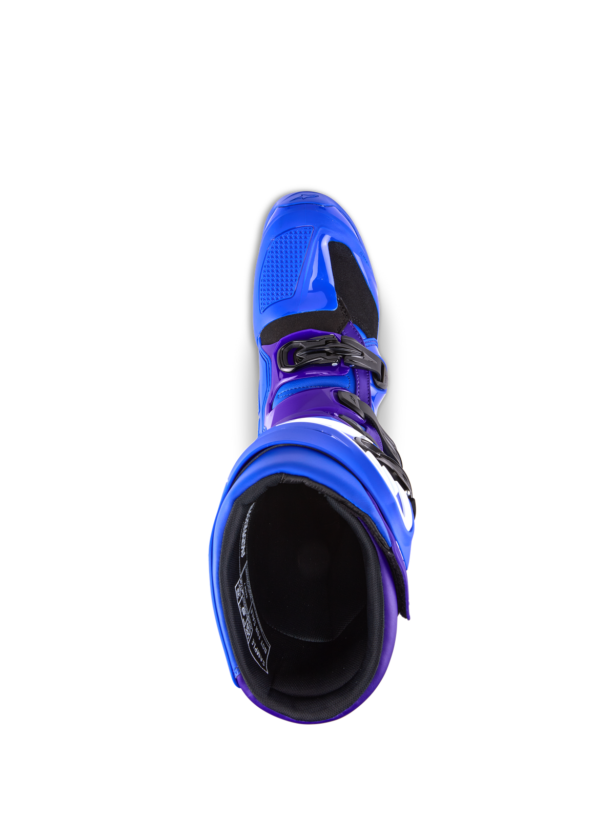Botas Alpinestars Tech 7, botas de motocross, azules con detalles en púrpura y negro, vista superior que muestra el forro interior y el sistema de hebillas, construcción duradera de TPU y microfibra para rendimiento off-road