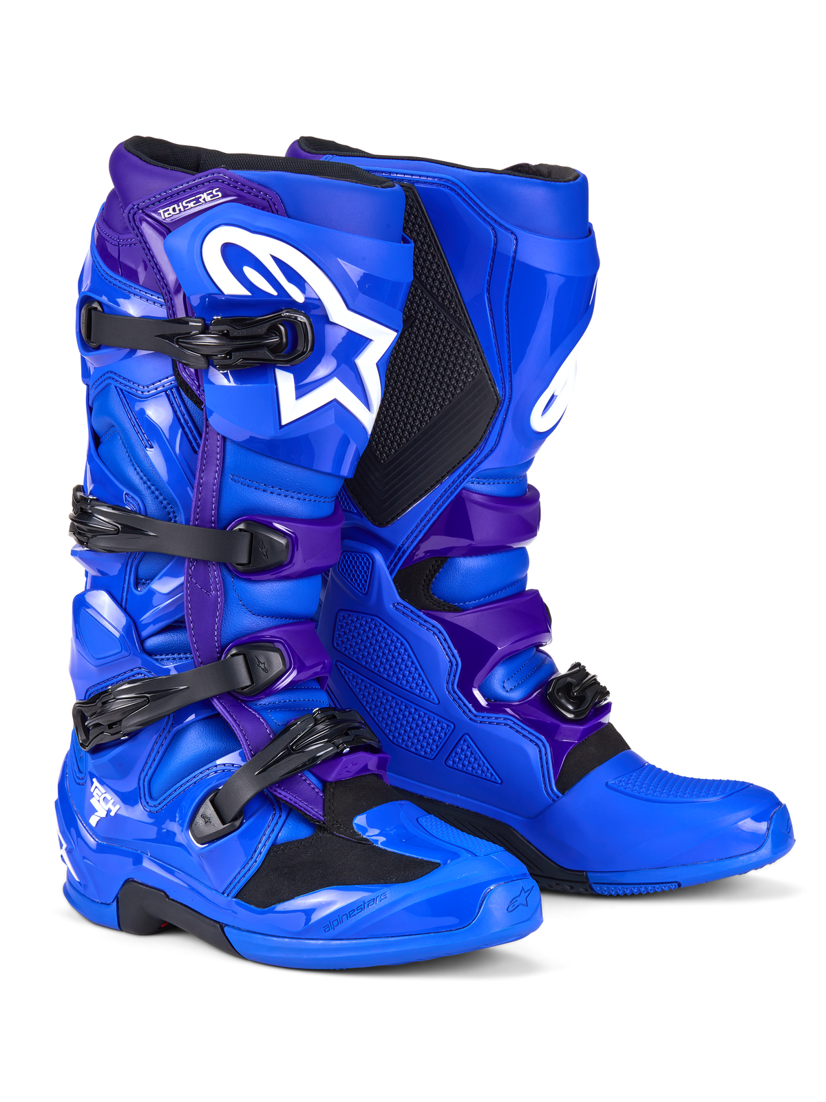 Botas Alpinestars Tech 7, botas de motocross, azules y moradas, con logotipos de Alpinestars en blanco, paneles protectores de TPU, sistema de cierre de cuatro hebillas y un diseño de suela resistente para todoterreno