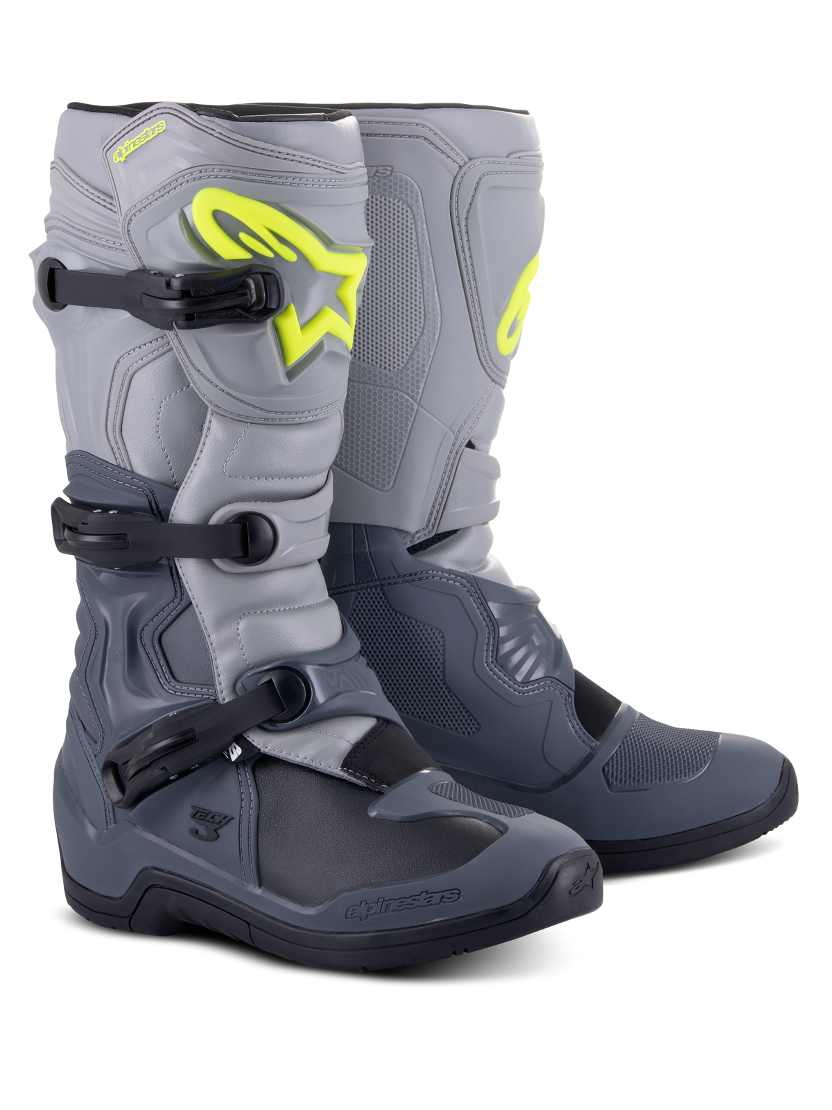 Botas Alpinestars Tech 3, botas de motocross, gris oscuro, gris claro y negro, con un destacado logotipo de Alpinestars en amarillo fluorescente, sistema de cierre de tres hebillas y paneles protectores reforzados para rendimiento todoterreno