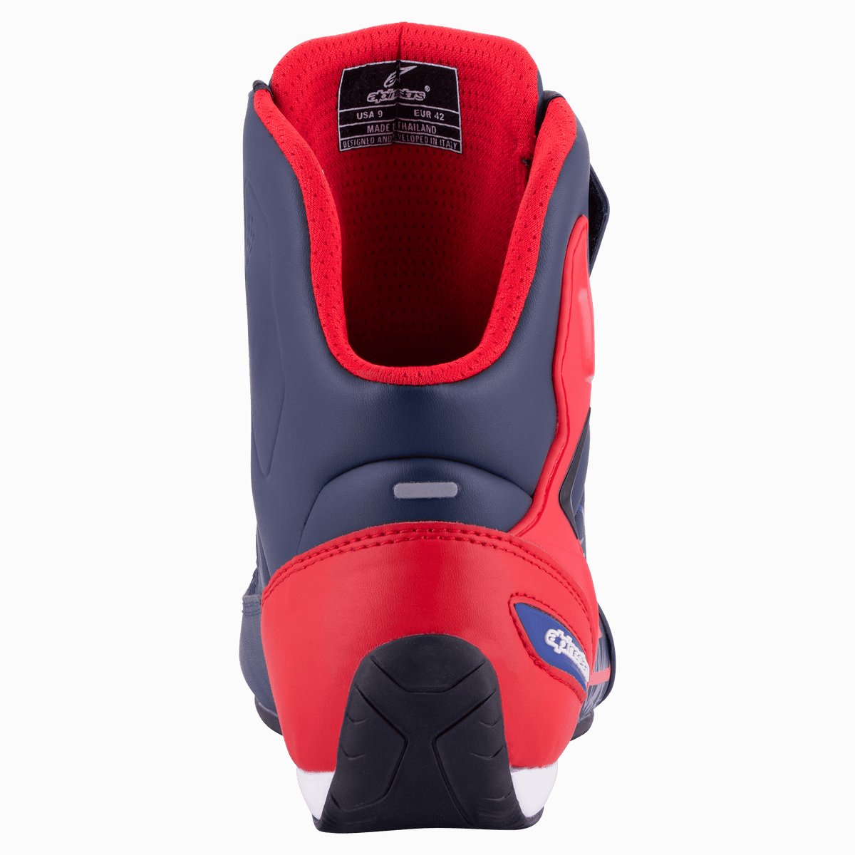 Alpinestars Austin Riding Shoe, Night Navy and Bright Red, rear view showing reinforced TPU heel counter, red mesh lining, and textured rubber outsole, sporty motorcycle footwear