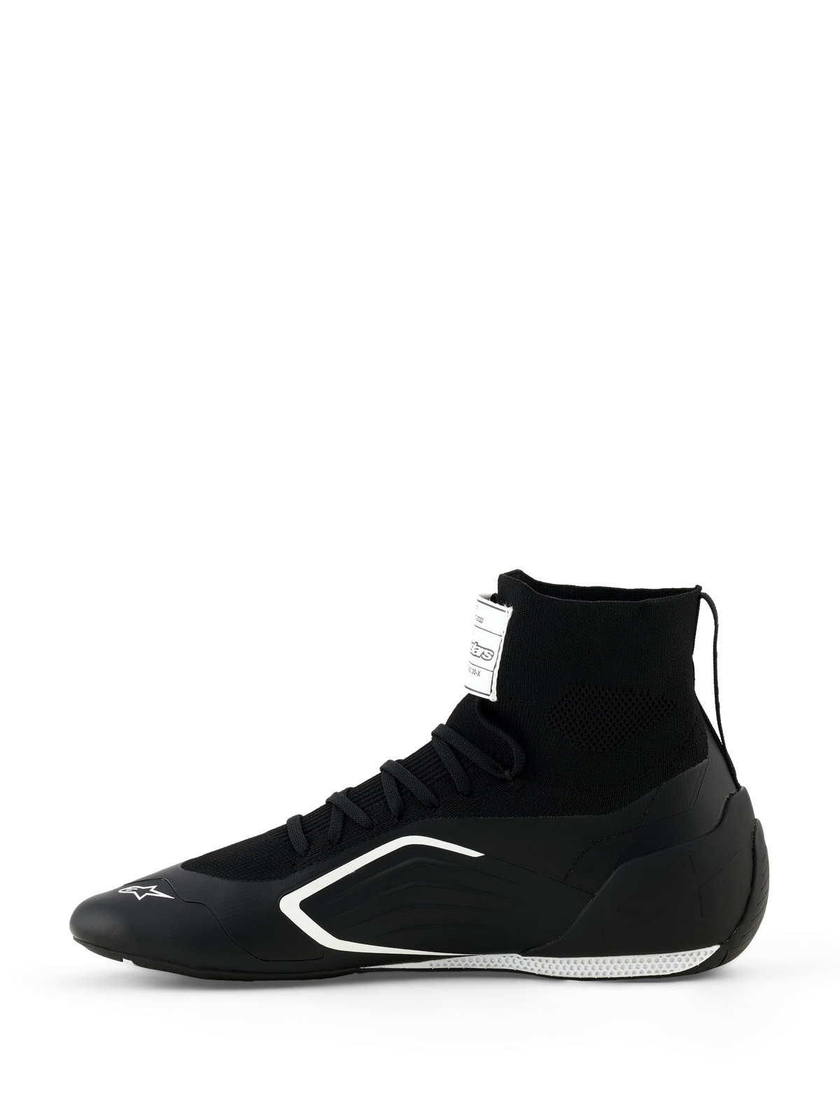 Alpinestars Supertech K Shoes - FIA, zapatillas de karting, en negro y blanco, vista de perfil lateral, con una construcción de caña alta completamente tejida, gráficos laterales angulares en blanco y logotipo blanco en la punta, calzado técnico de carreras