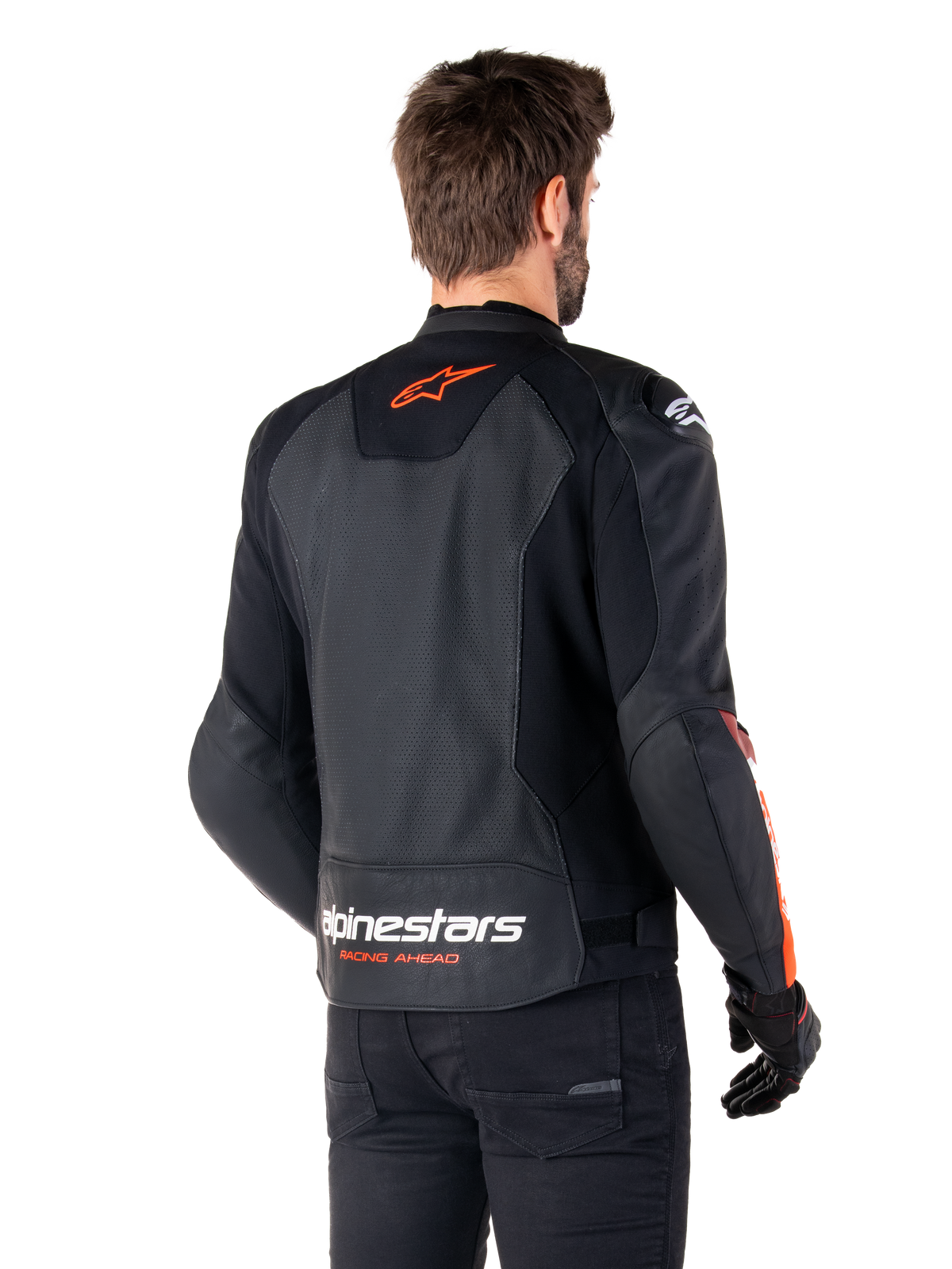 Alpinestars Faster V3 Airflow Leather Jacket, Sport Motorcycle Jacket, Black with Red Fluo, back view, featuring perforated leather panels, orange-red Alpinestars logo on upper back and white branding on the lower back, worn with black pants and gloves, sleek race-derived style