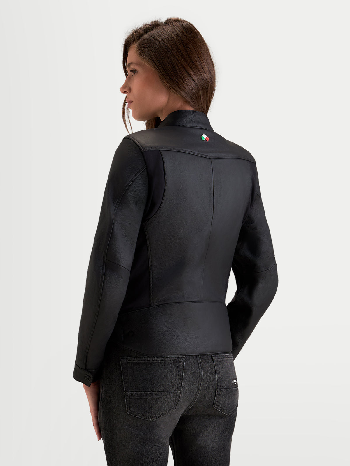 Alpinestars Stella Maver-X Leather Jacket, women's urban motorcycle leather jacket in black, rear three-quarter view showing premium bovine leather construction and tailored fit worn by a model.