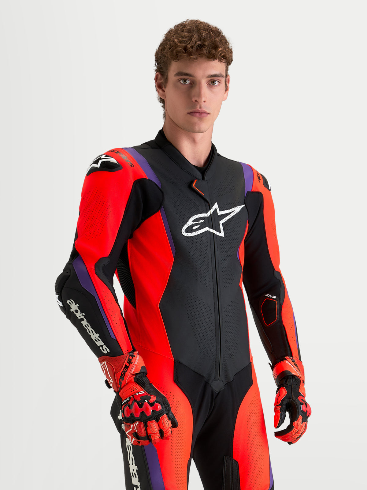 Alpinestars Missile V3 Leather Suit, mono de cuero de una pieza para moto de carreras, negro, rojo y morado, con modelo
