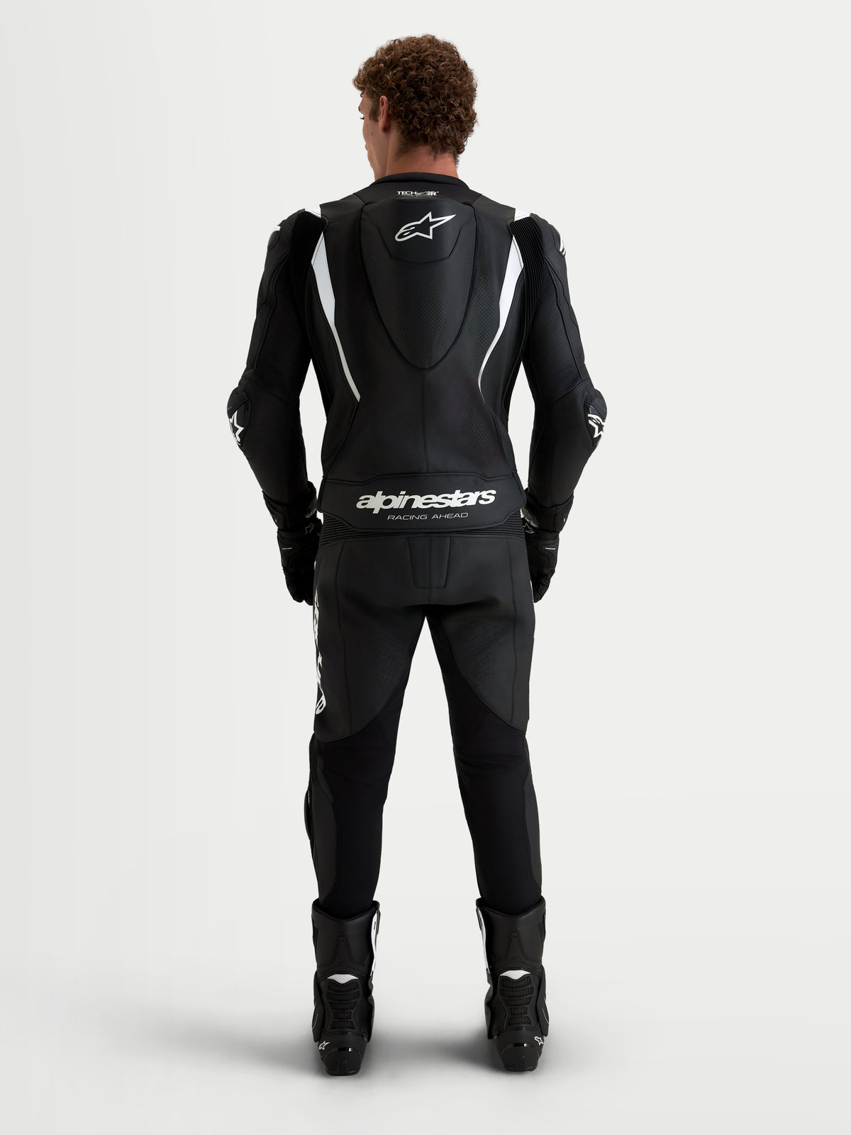 Alpinestars Missile V3 mono de cuero de 2 piezas, mono de moto para carreras en negro y blanco, vista trasera con joroba aerodinámica