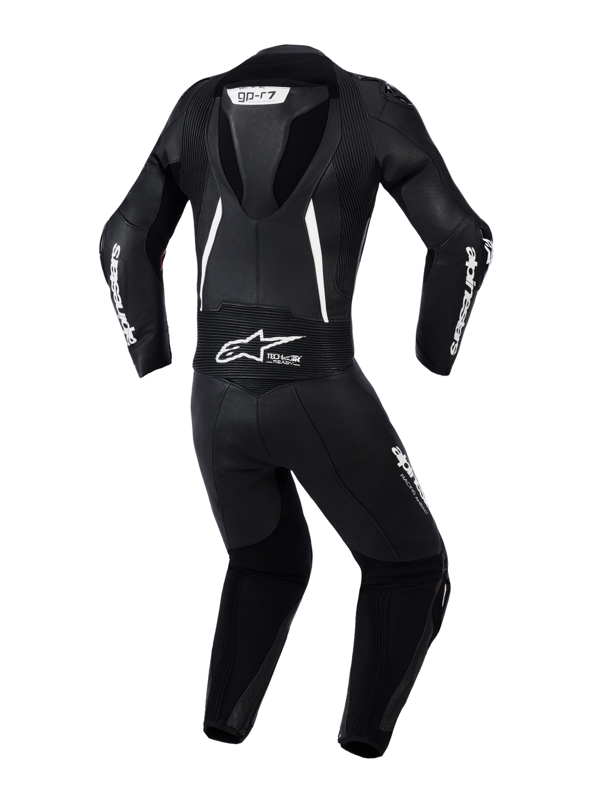 Traje de cuero de 2 piezas Alpinestars Stella GP-R7 para mujer, vista trasera en negro con detalles blancos, con joroba aerodinámica integrada, paneles elásticos de acordeón en hombros y zona lumbar, cuero perforado para ventilación y marca Alpinestars destacada.