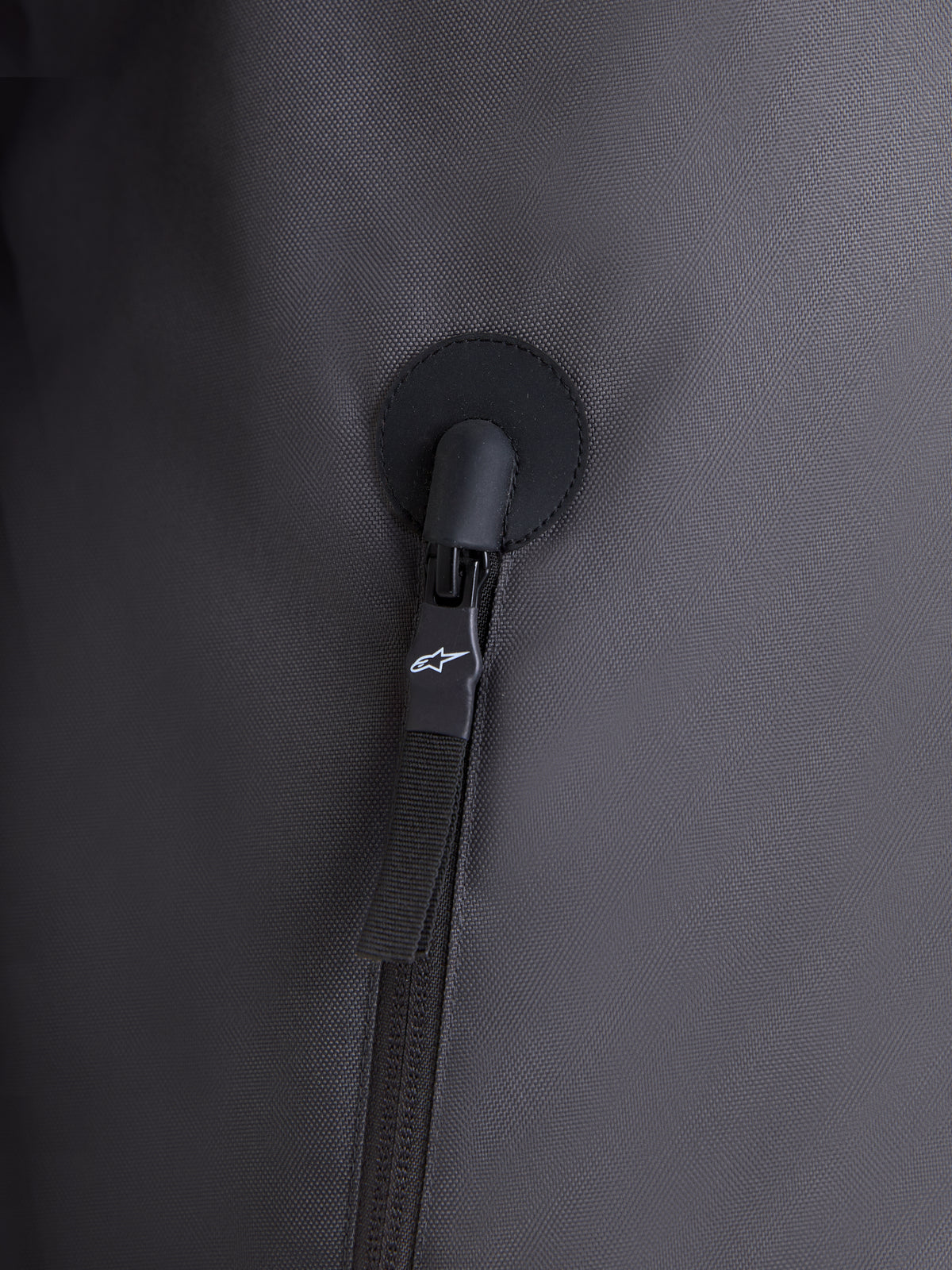 Alpinestars Morfex Parka Waterproof Jacket, close-up view of the zipper detail and durable lunar gray and black textile construction, urban motorcycle apparel feature shot
