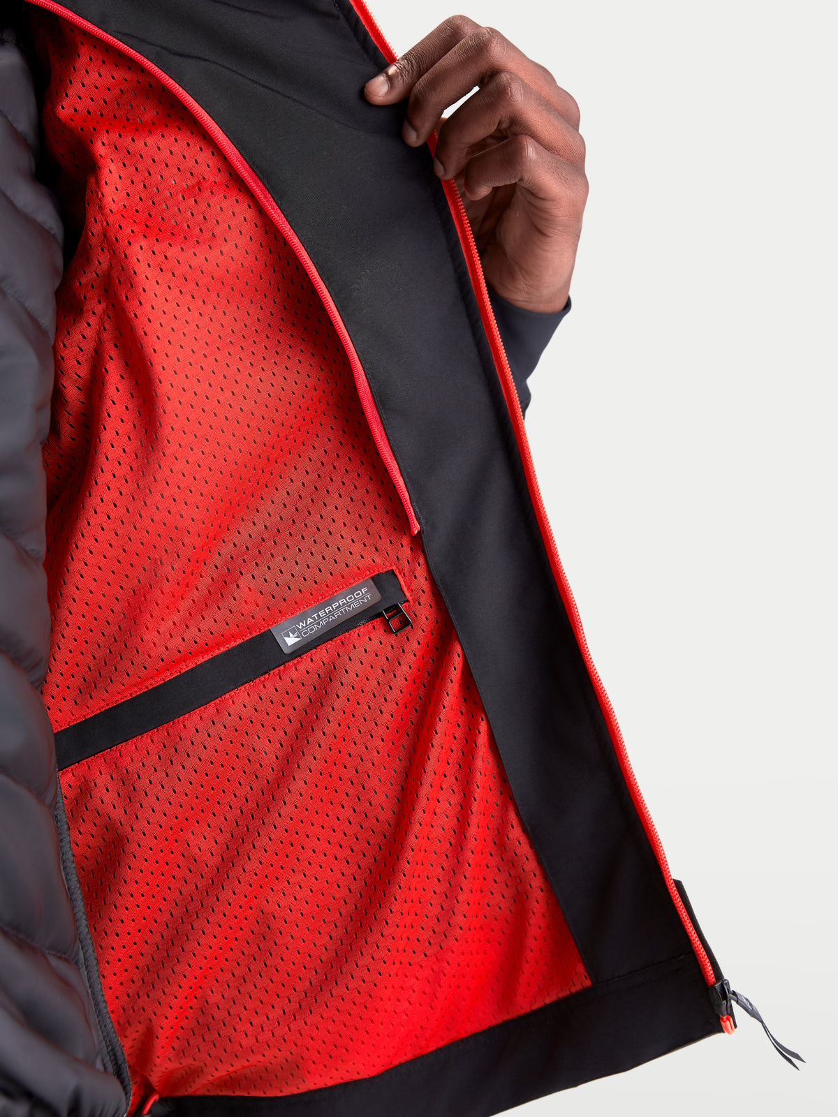 Alpinestars Morfex Parka Waterproof Jacket, men's urban textile motorcycle jacket in lunar gray and black, close-up interior view showing vibrant red mesh lining and waterproof compartment label