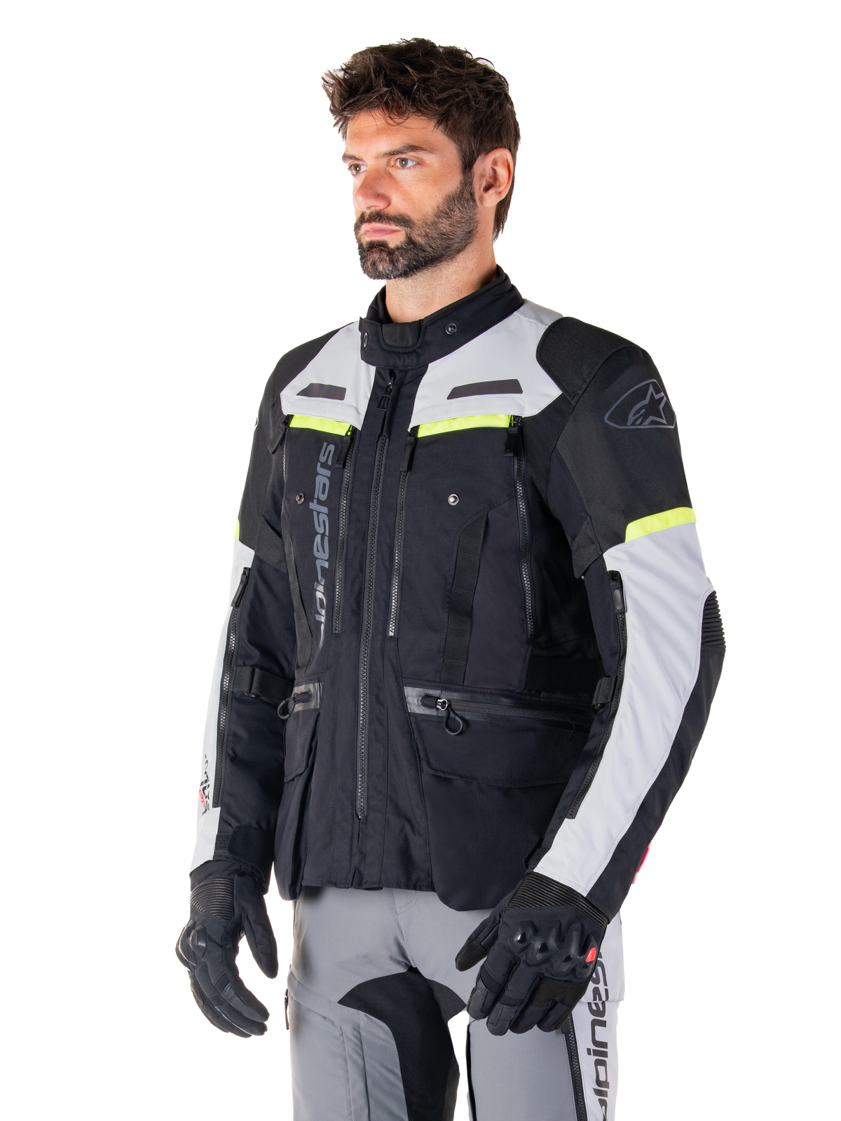 Alpinestars Bogotá Pro Drystar® Jacket, Black and Ice Gray adventure touring jacket with Yellow Fluo accents, worn by a man.