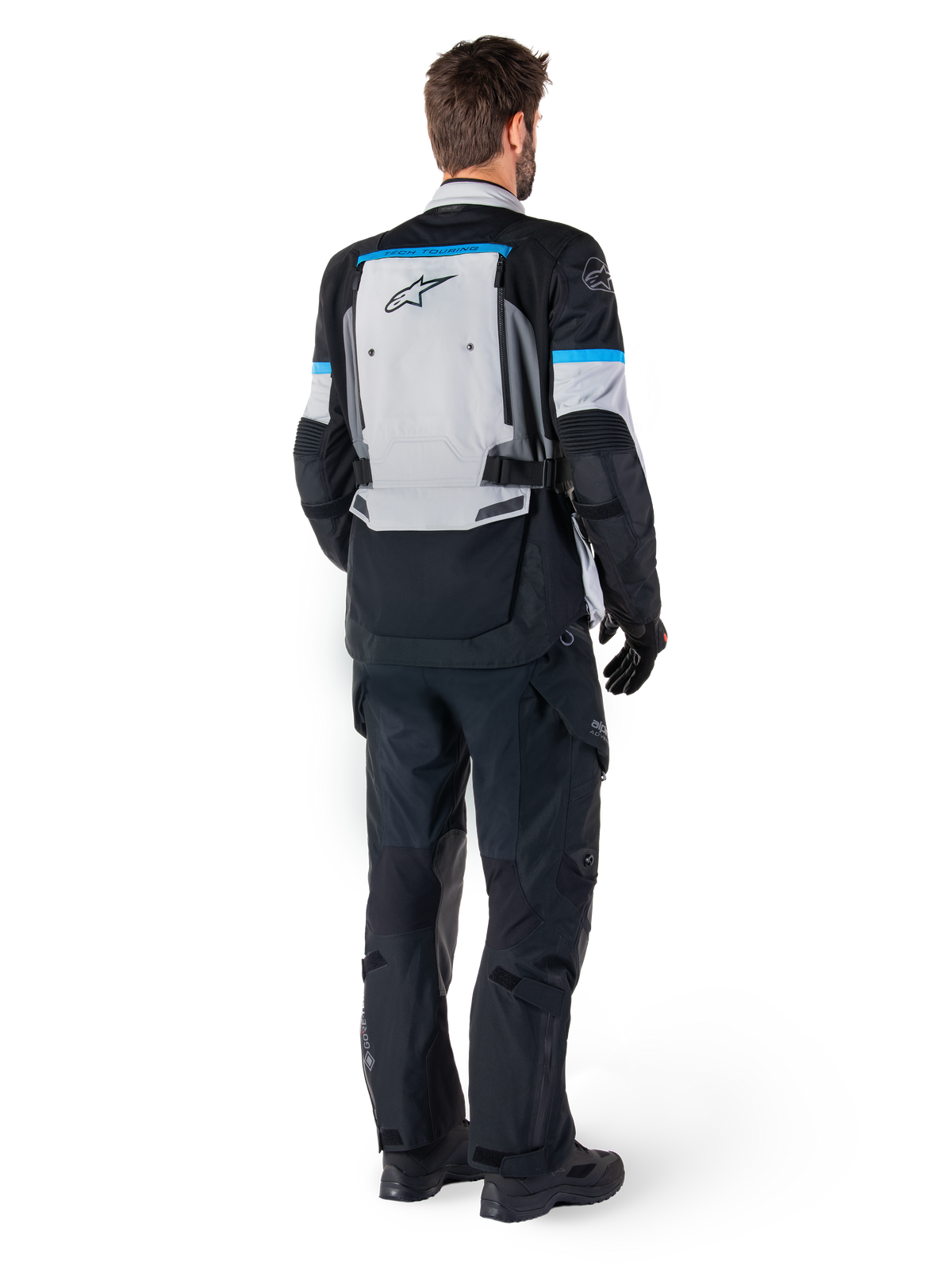 Chaqueta Alpinestars Bogotá Pro Drystar® para hombre, touring adventure, gris hielo y negro, vista trasera con detalles cian
