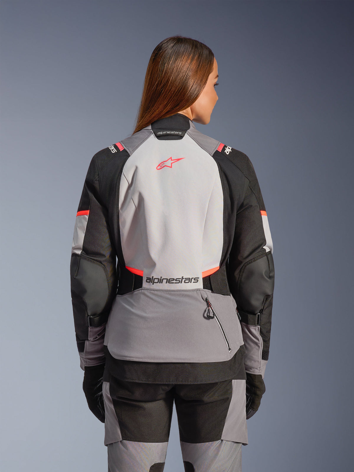 Alpinestars Stella Andes V4 Drystar® Jacket, a women's adventure motorcycle jacket in gray and coral, rear view.