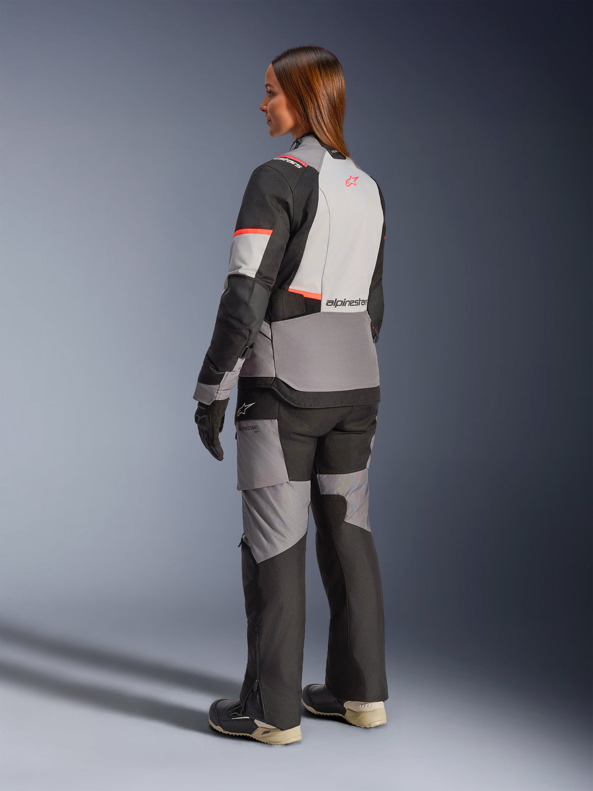 Alpinestars Stella Andes V4 Drystar Jacket, Women's gray/black waterproof adventure jacket with coral accents, rear view.