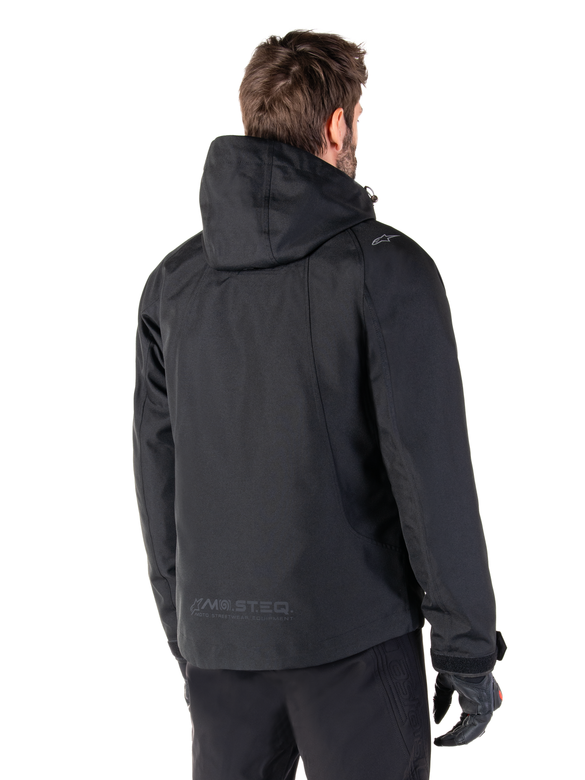 Alpinestars parka impermeable Morush, chaqueta de moto urbana para hombre, negra, vista trasera con capucha y marca MO.ST.EQ.