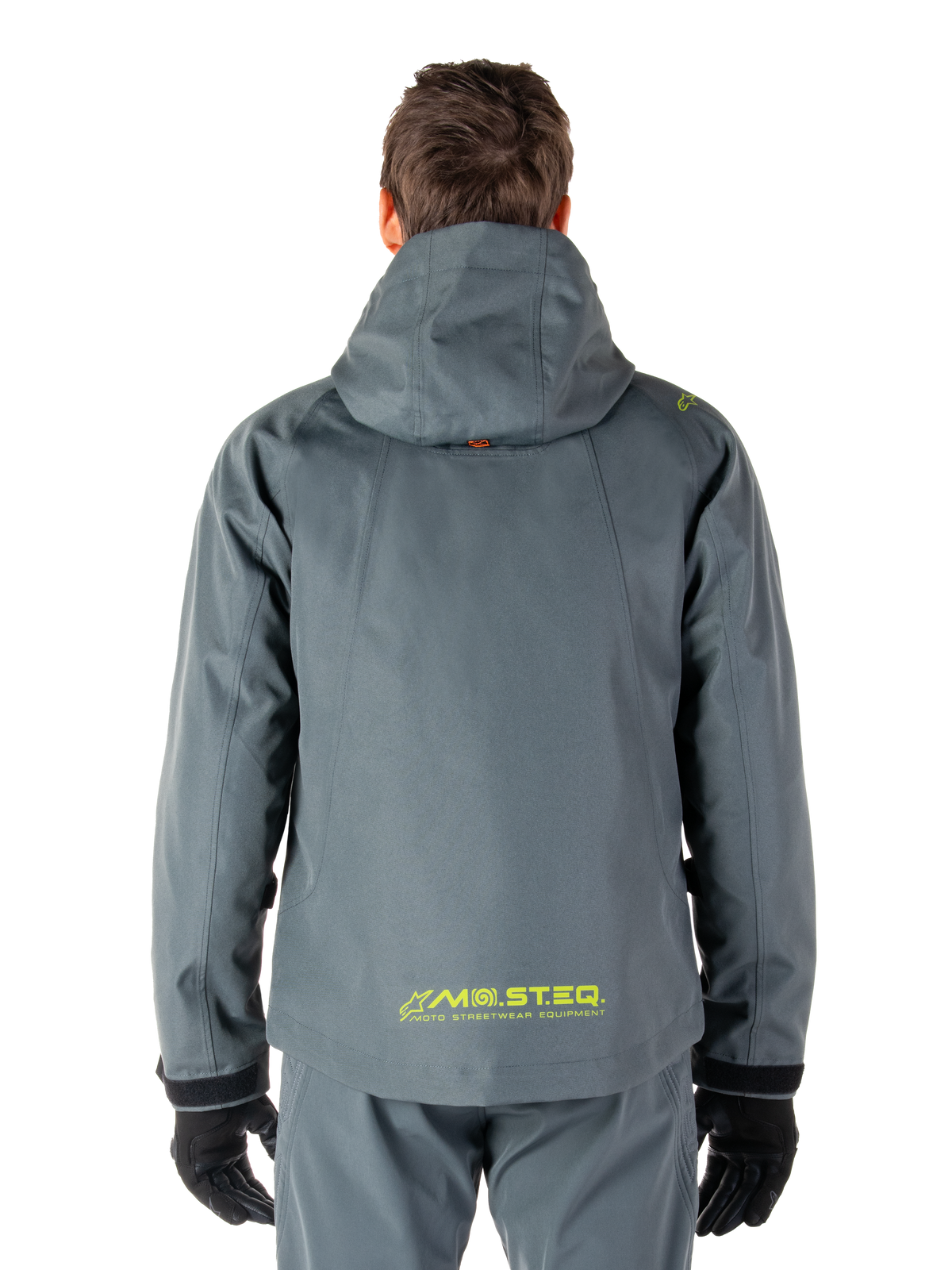 Alpinestars Morush Waterproof Parka, Motorcycle Jacket, Urban Gray, back view showing the hooded design and yellow MO.ST.EQ. logo on the lower back, modern urban streetwear-inspired motorcycle gear