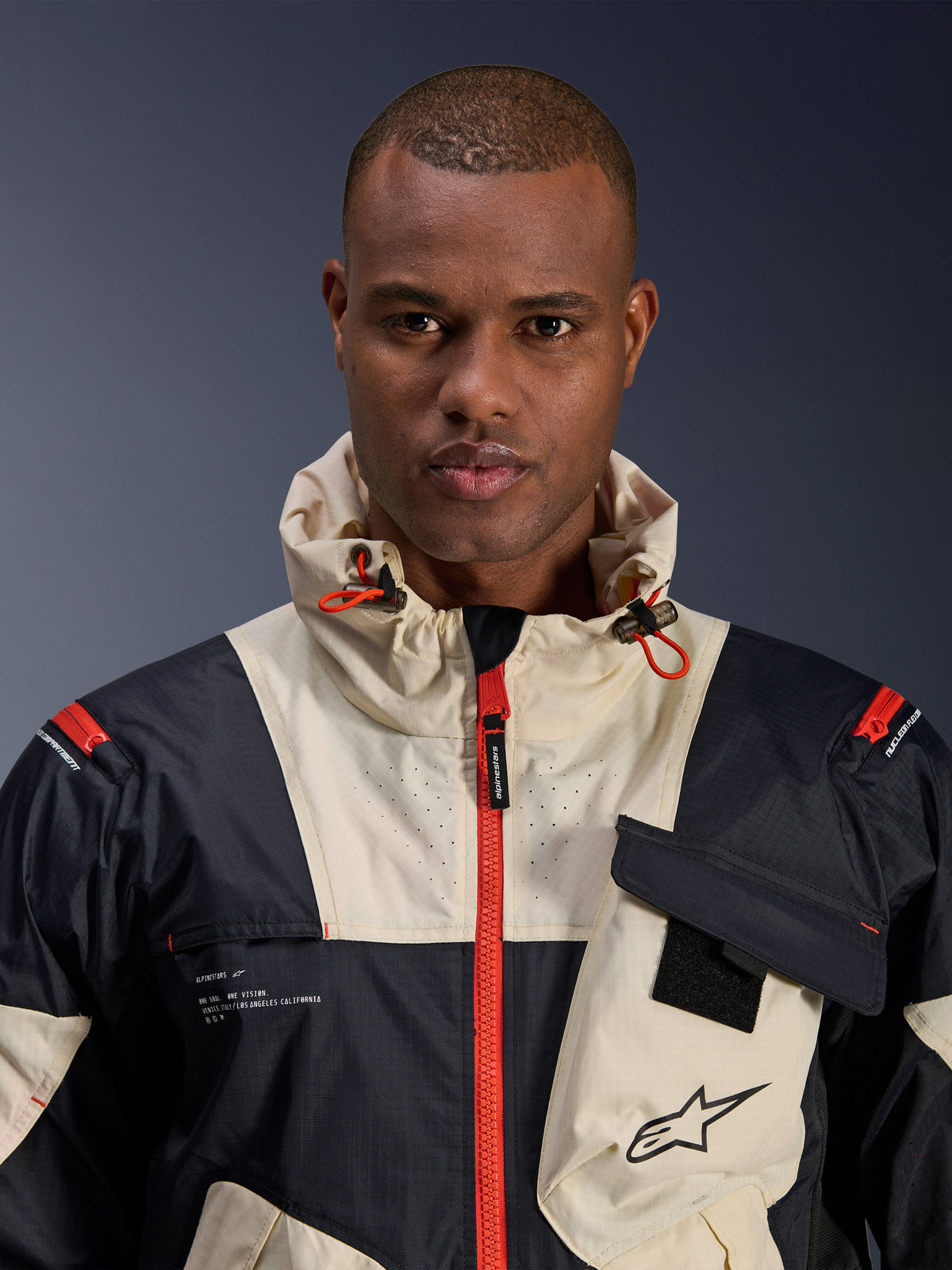 Alpinestars Mogress Air, chaqueta de moto urbana para hombre, negra y naranja, tejido ripstop con capucha.