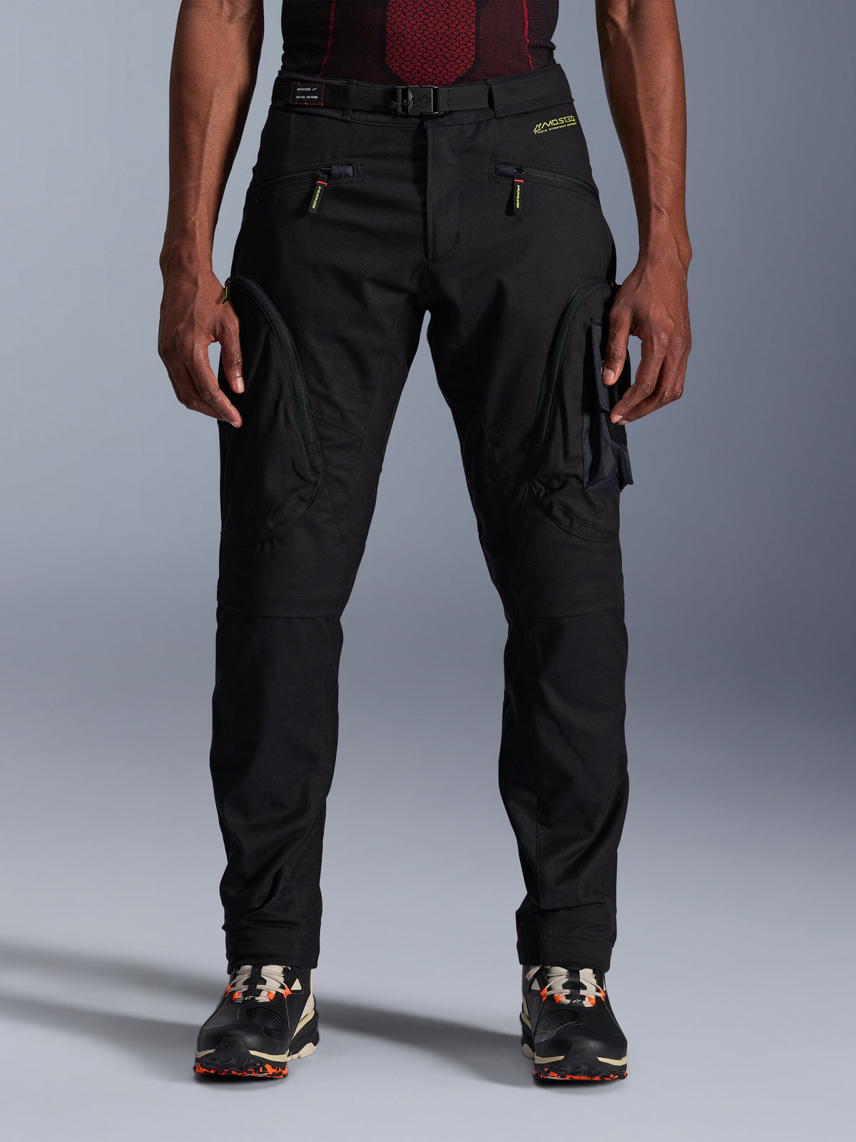 Alpinestars Acteon Pants, Black Urban Motorcycle Pants, tapered regular fit featuring side cargo pockets with reverse coil zippers, integrated waist belt and yellow branding, protective textile riding gear