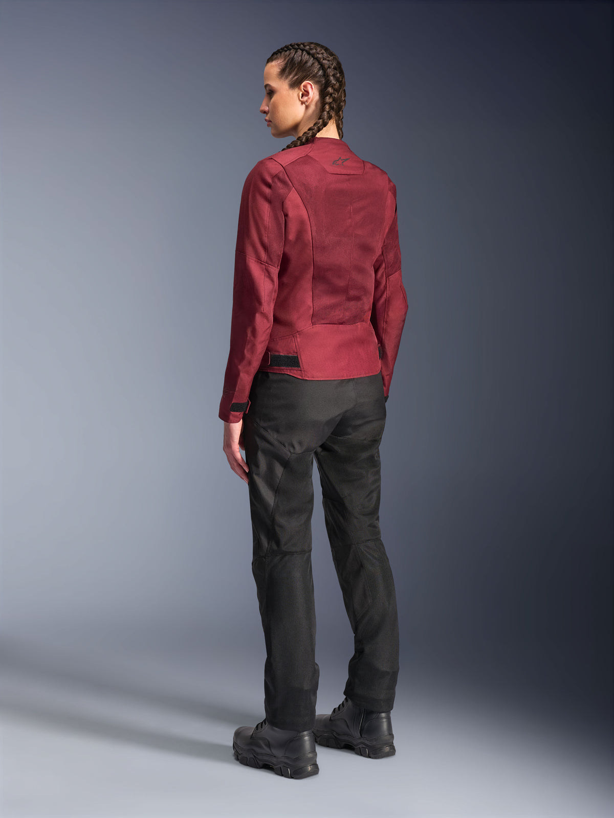 Alpinestars Woman Stella C-1 Air Jacket, Burgundy, back view showing mesh panels and refined detailing, worn with black motorcycle pants and boots, urban contemporary riding gear.
