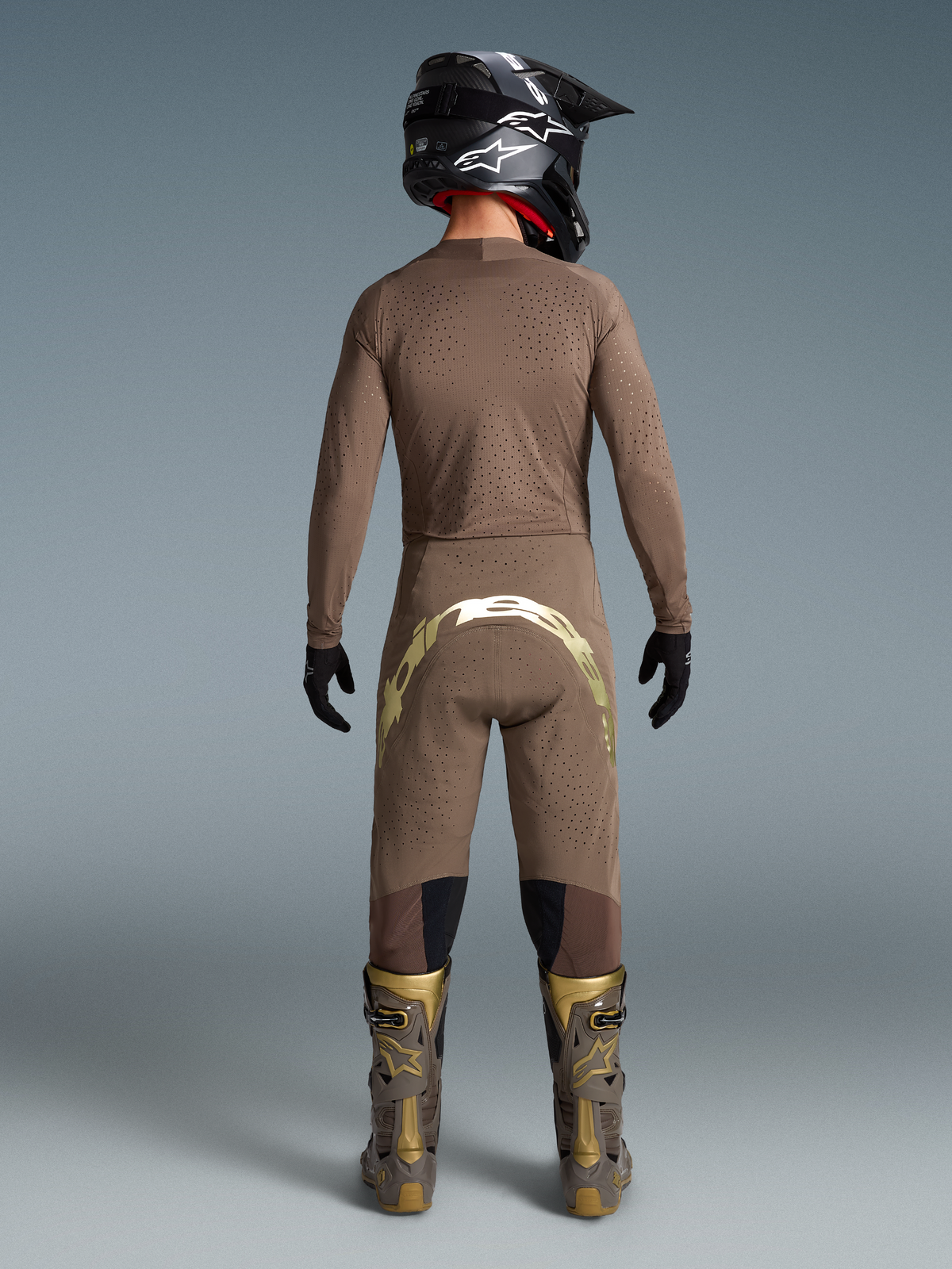 Alpinestars Limited Edition Supertech Air Gold motocross gear, men's ventilated brown and gold jersey, pants, and boots.