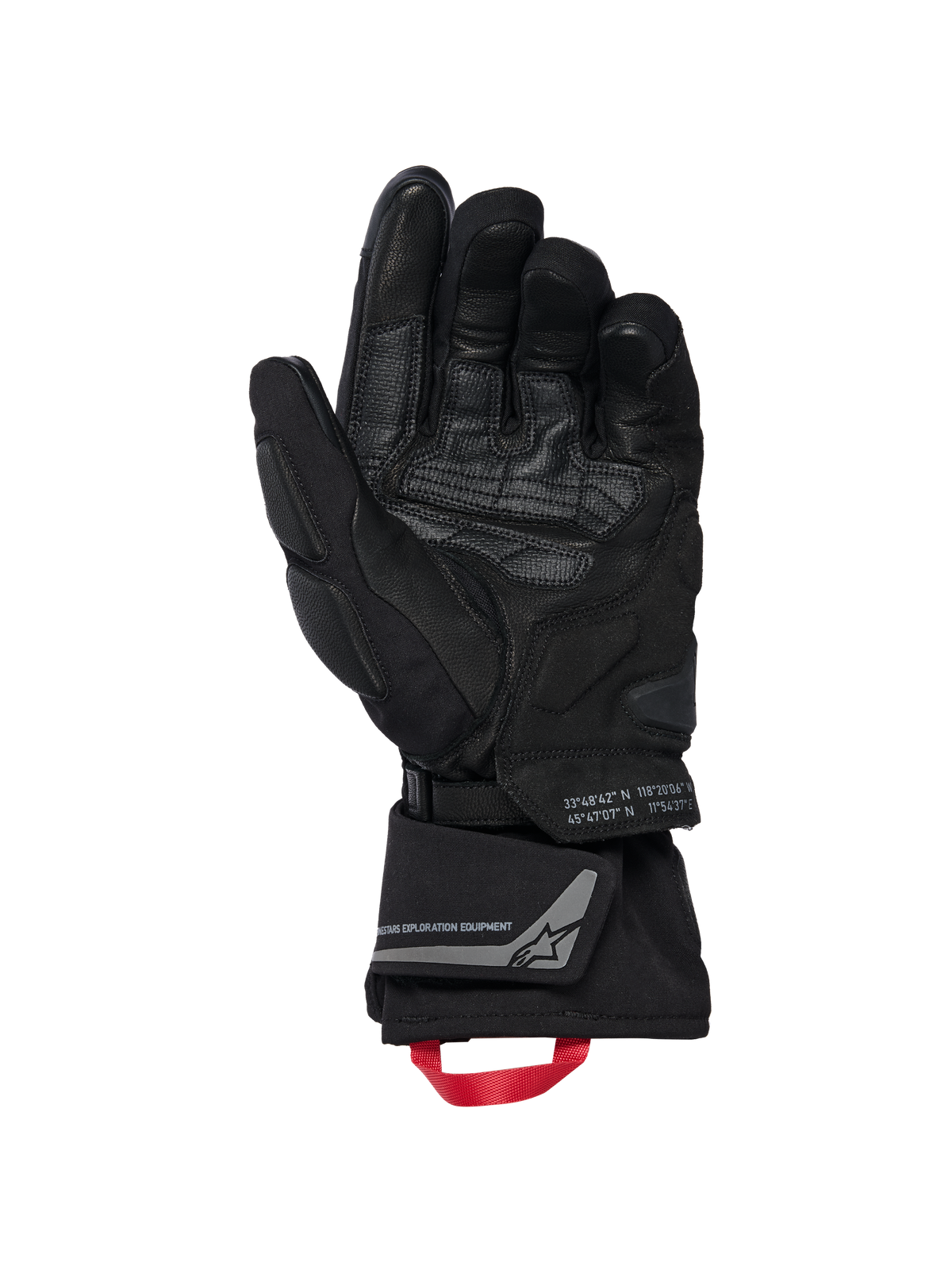 Guantes Alpinestars WT-8 GORE-TEX Aislados, guantes de moto, negros, vista de la palma interior que muestra parches de cuero reforzados y deslizadores acolchados, puño largo con tirador rojo y marca Alpinestars Exploration Equipment con coordenadas geográficas, diseño técnico para carretera y aventura