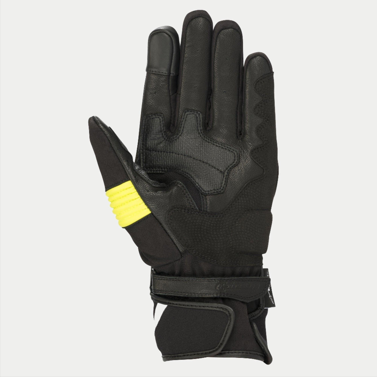 Guantes Alpinestars T-SP W Drystar®, negro y amarillo flúor, vista de la palma que muestra la construcción en piel de cabra con detalles en amarillo fluorescente en el pulgar, puntas de los dedos compatibles con pantallas táctiles y doble cierre de velcro en la muñeca.