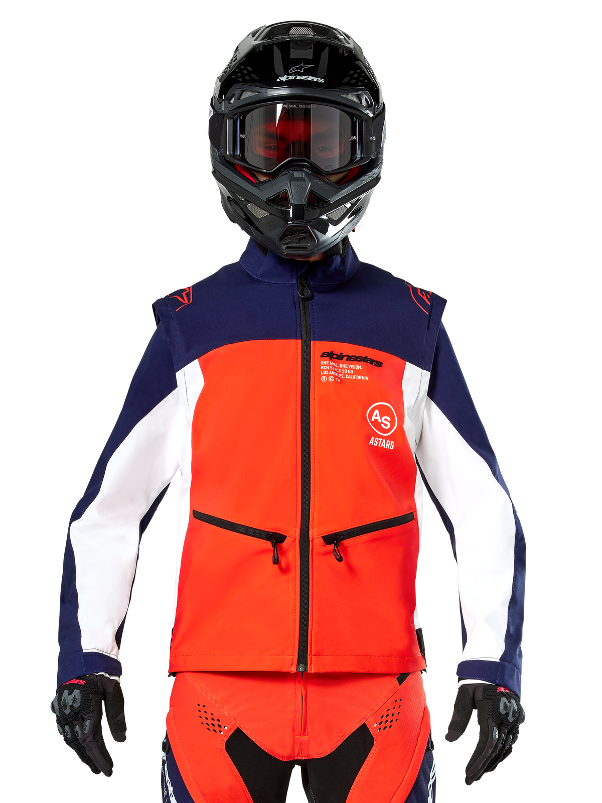 Alpinestars Lite-Dura Softshell Jacket in Navy, Hot Orange, and White, front view on a rider wearing a black helmet and goggles, featuring a color-blocked technical design with zippered hand pockets and Alpinestars branding, versatile gear for enduro and off-road riding