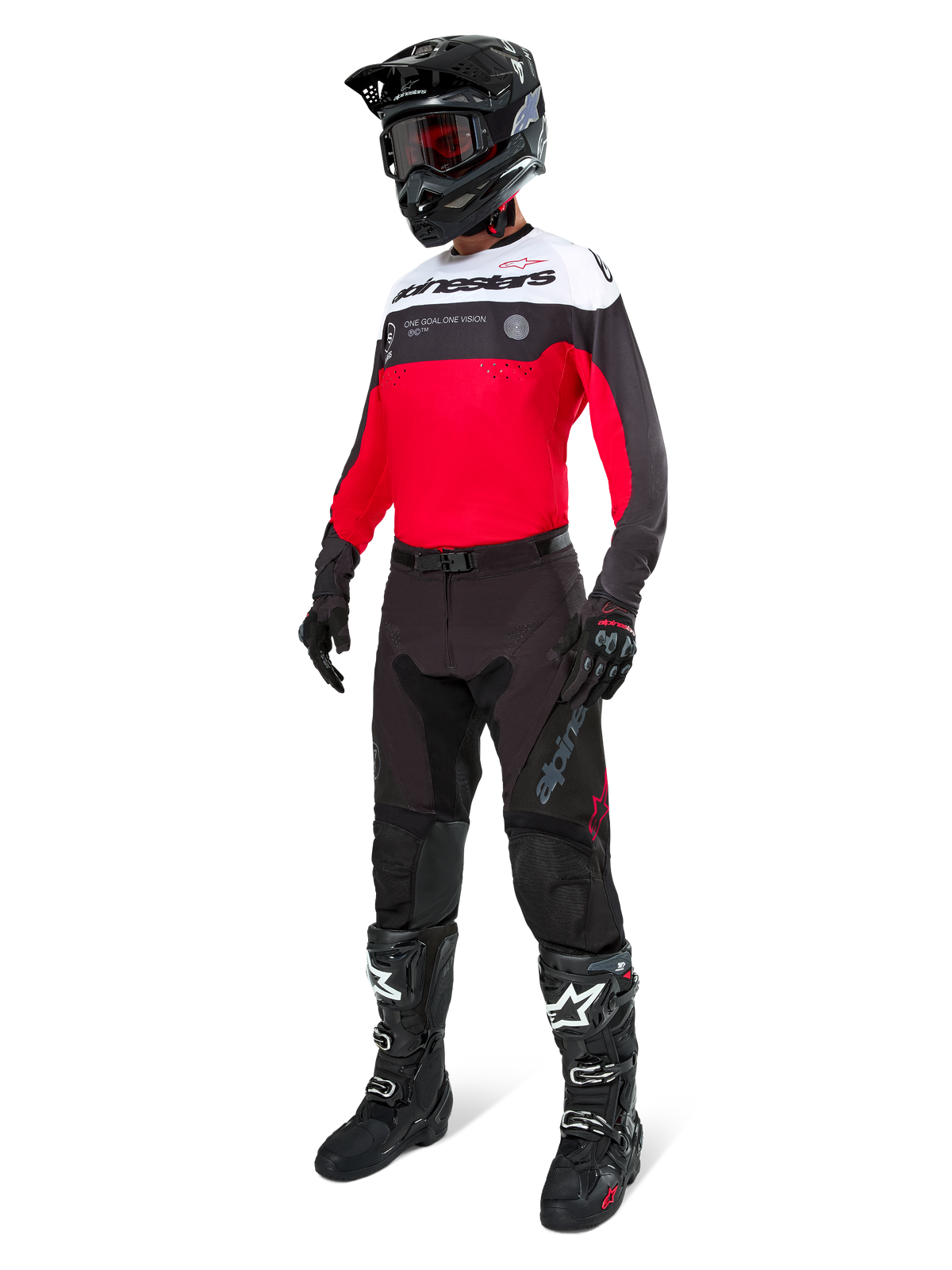 Pantalones Alpinestars Pro-Dura en negro magnet blanco, usados por un piloto con un jersey a juego en rojo, negro y blanco, casco negro y botas off-road negras, conjunto completo de equipamiento profesional de enduro para rendimiento off-road.
