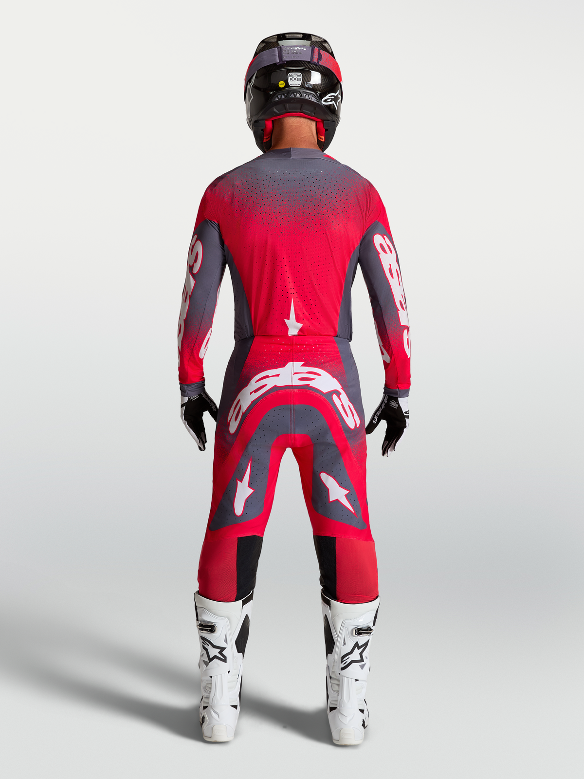 Supertech Hiten AFD Gear Set y pantalones de Alpinestars, equipo de motocross rojo fluorescente y gris, vista trasera