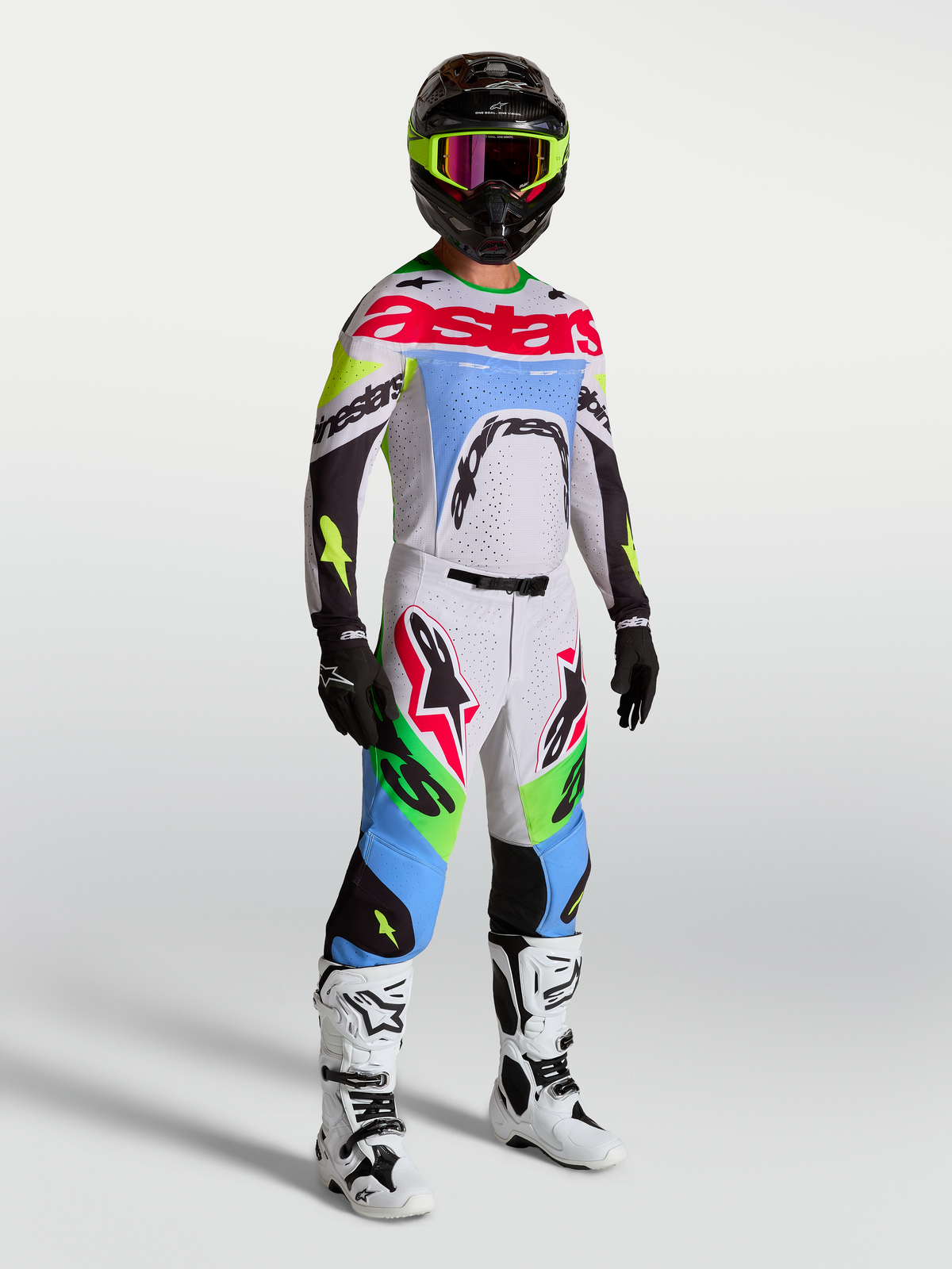 Pantalones Supertech Dyna de Alpinestars, equipo de motocross para hombre, lila claro y verde fluo, en modelo con kit de carreras completo.