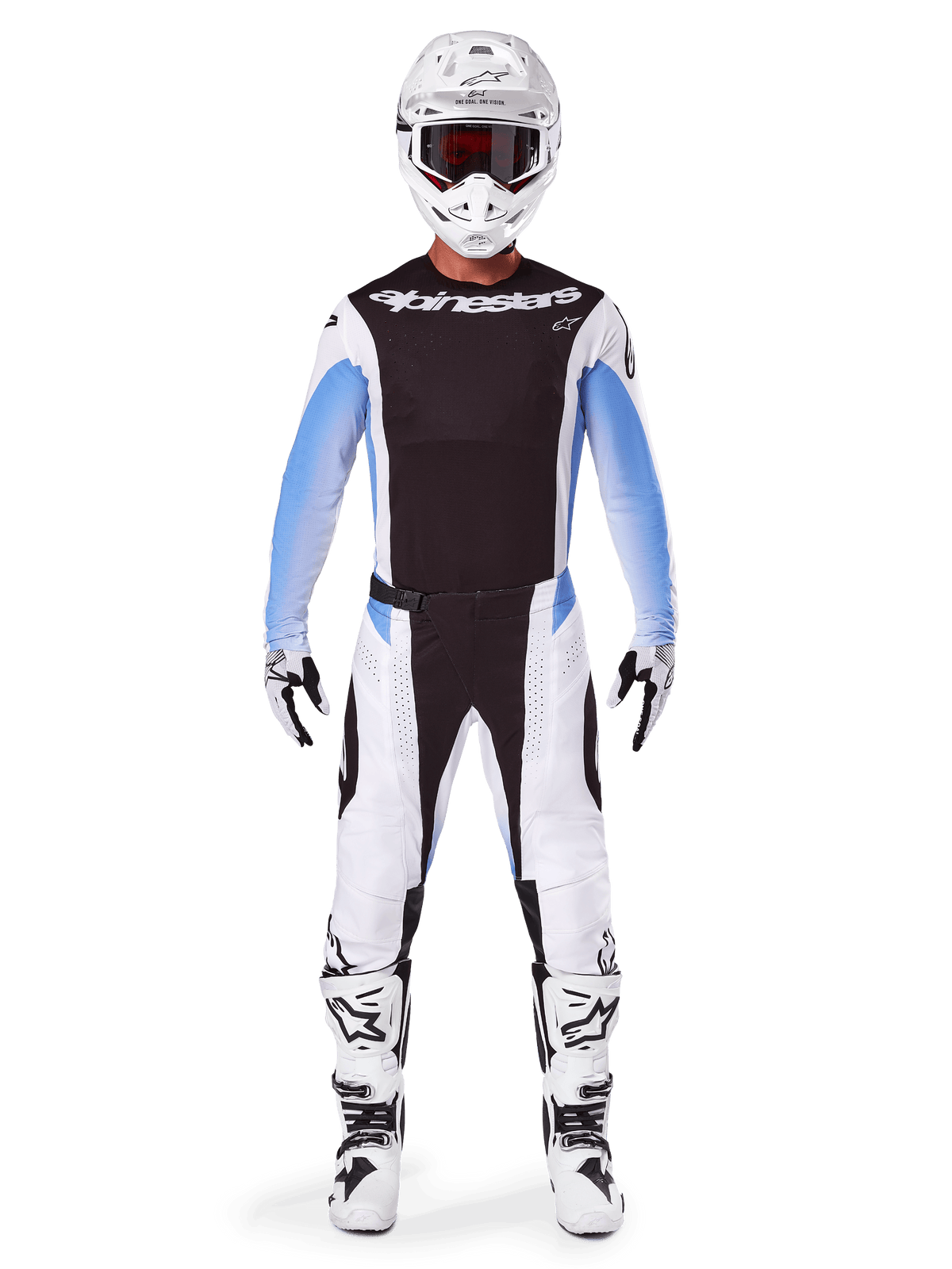 Piloto de motocross con pantalones Alpinestars Techstar Melt 2025, pantalones de motocross negros y azules, diseño de paneles múltiples en blanco y negro con detalles azules en la cadera, combinados con jersey blanco a juego, casco blanco, guantes blancos y botas para un equipo completo de carreras todoterreno