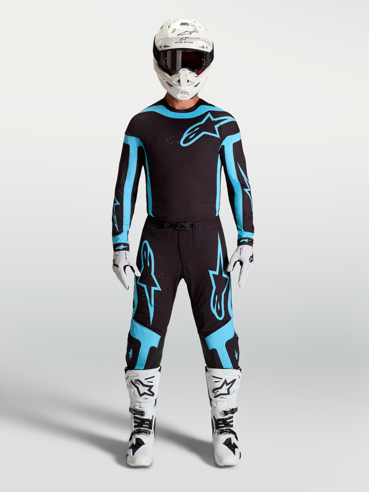 Pantalones Alpinestars Supertech Vesta para motocross, hombre, negro y turquesa, construcción elástica ligera en modelo.