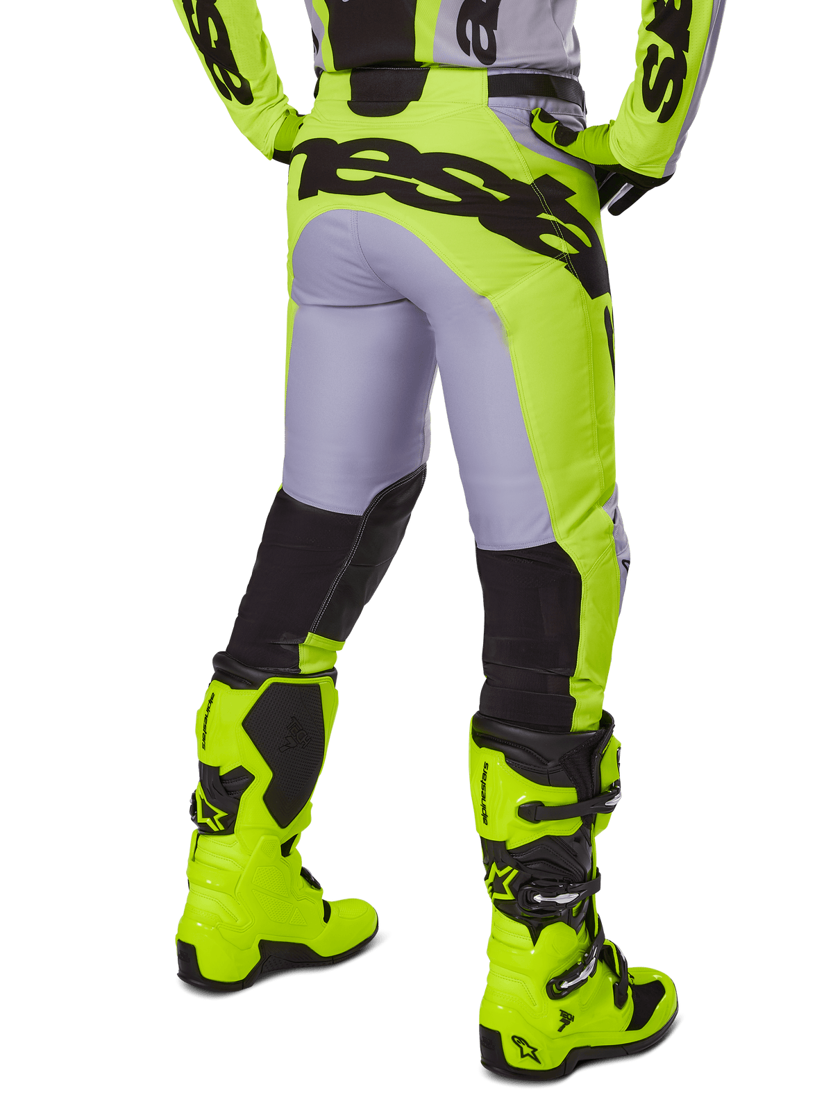 Alpinestars 2025 Racer Veil Pants, pantalones de motocross, gris y amarillo flúor, vista trasera que muestra la construcción ergonómica con una gran marca negra en el asiento, paneles negros en la parte inferior de las piernas y botas de carreras en amarillo brillante a juego