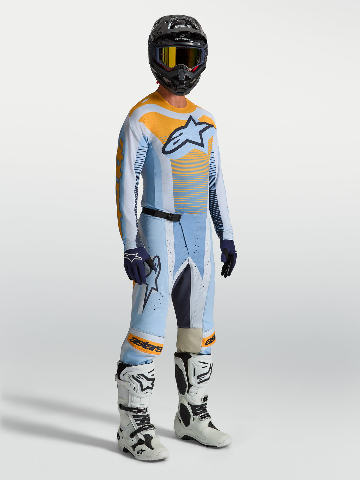 Pantalones Alpinestars Techstar Maven de motocross para hombre, azul y naranja, ajuste atlético de carreras con zonas elásticas.