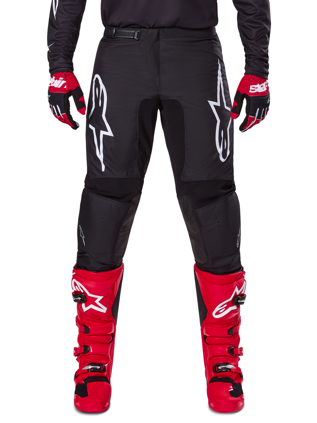 Alpinestars 2025 Fluid Haul Gear Set, Black Motocross Pants with white Astars logos on thighs, paired with vibrant red boots and red and black gloves, coordinated motocross outfit for off-road racing