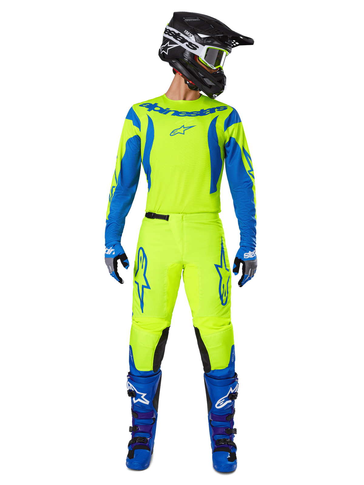 Pantalones Alpinestars Fluid Haul 2025, pantalones de motocross, amarillo fluorescente y azul, usados como un conjunto de equipamiento de competición completo con jersey a juego, botas azules y casco negro, con logotipos azules llamativos en los muslos y paneles negros en las rodillas