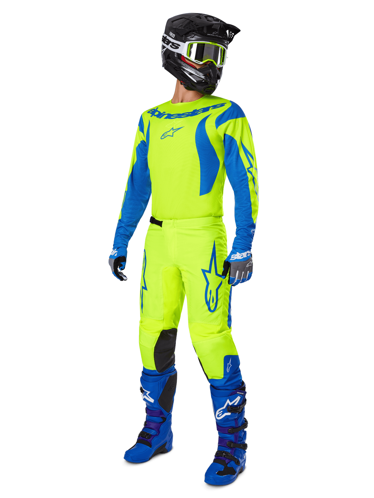 Alpinestars 2025 Fluid Haul Pants, pantalones de motocross, amarillo flúor y azul, usados como parte de un conjunto completo de equipamiento de carreras con jersey a juego, botas azules y casco negro, diseño de alta visibilidad para conducción todoterreno