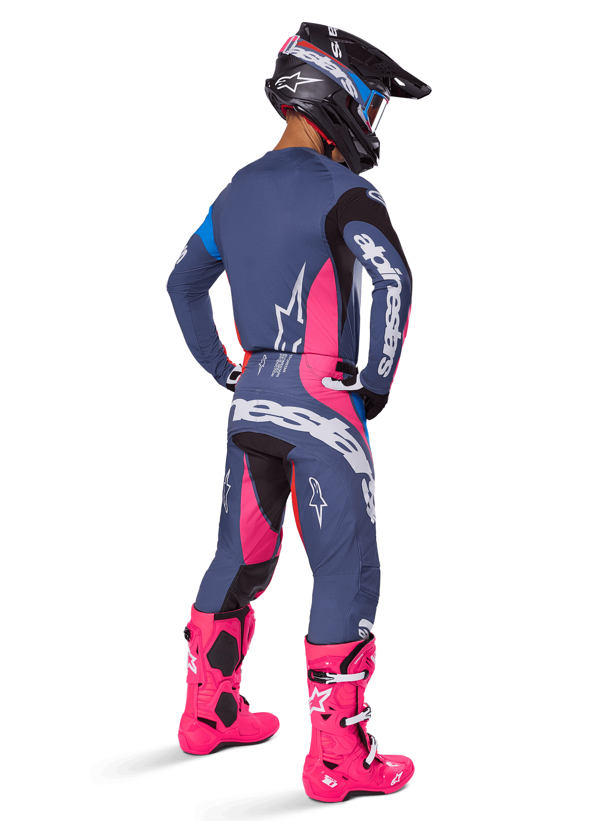 Motocross rider from behind wearing Alpinestars 2025 Techstar Dreem Pants, Gray-blue and Magenta pink design with black accents, worn with a matching jersey and vibrant pink boots, athletic race fit for off-road performance.