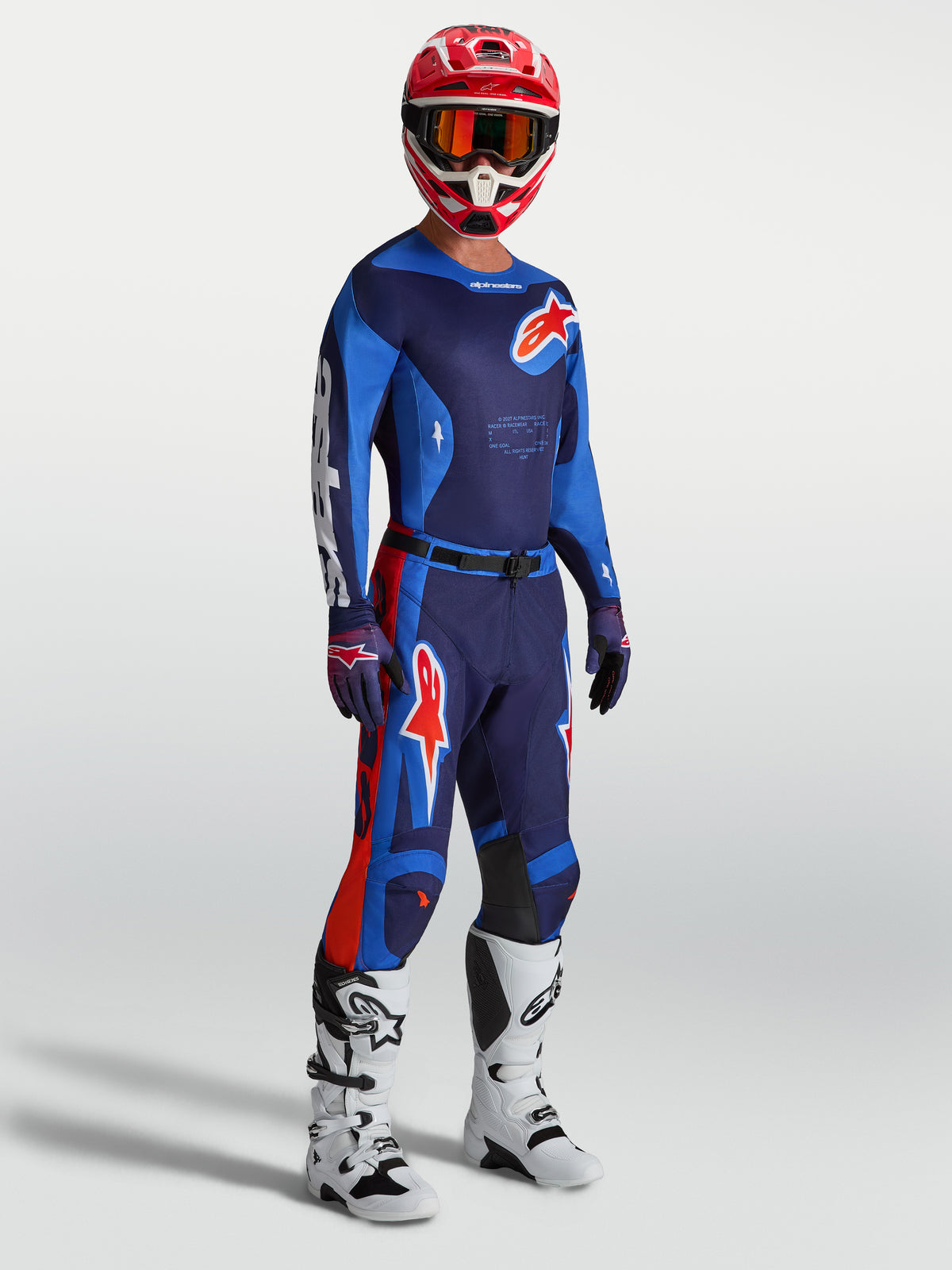 Pantalones Racer Hunt de Alpinestars, equipo de motocross para hombre en azul y rojo, con ajuste ergonómico y precurvado.